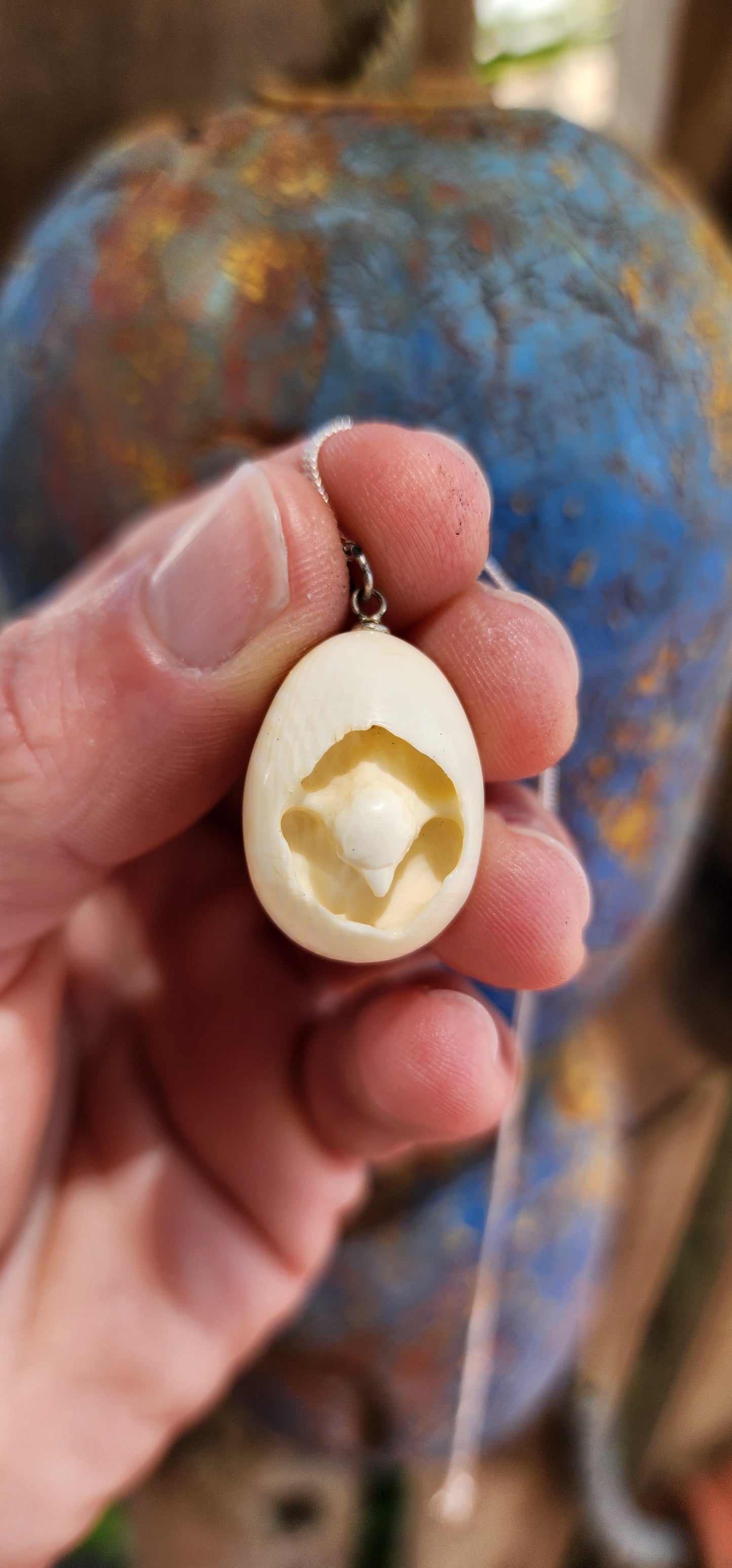 How adorable and truly unique!
This pendant is an exquisite example of Victorian-era craftsmanship and artistry, delicately carved from pre-ban ivory.