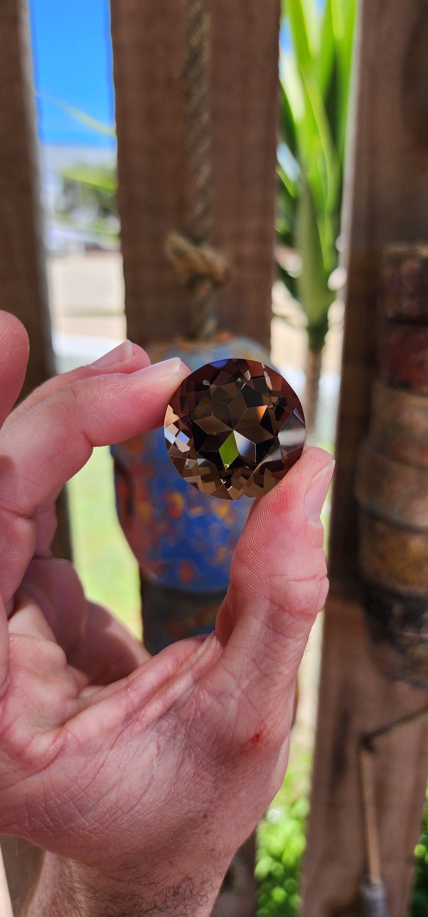 Very large unset natural smoky quartz gemstone, expertly faceted in a round brilliant cut to maximize its brilliance and luster.