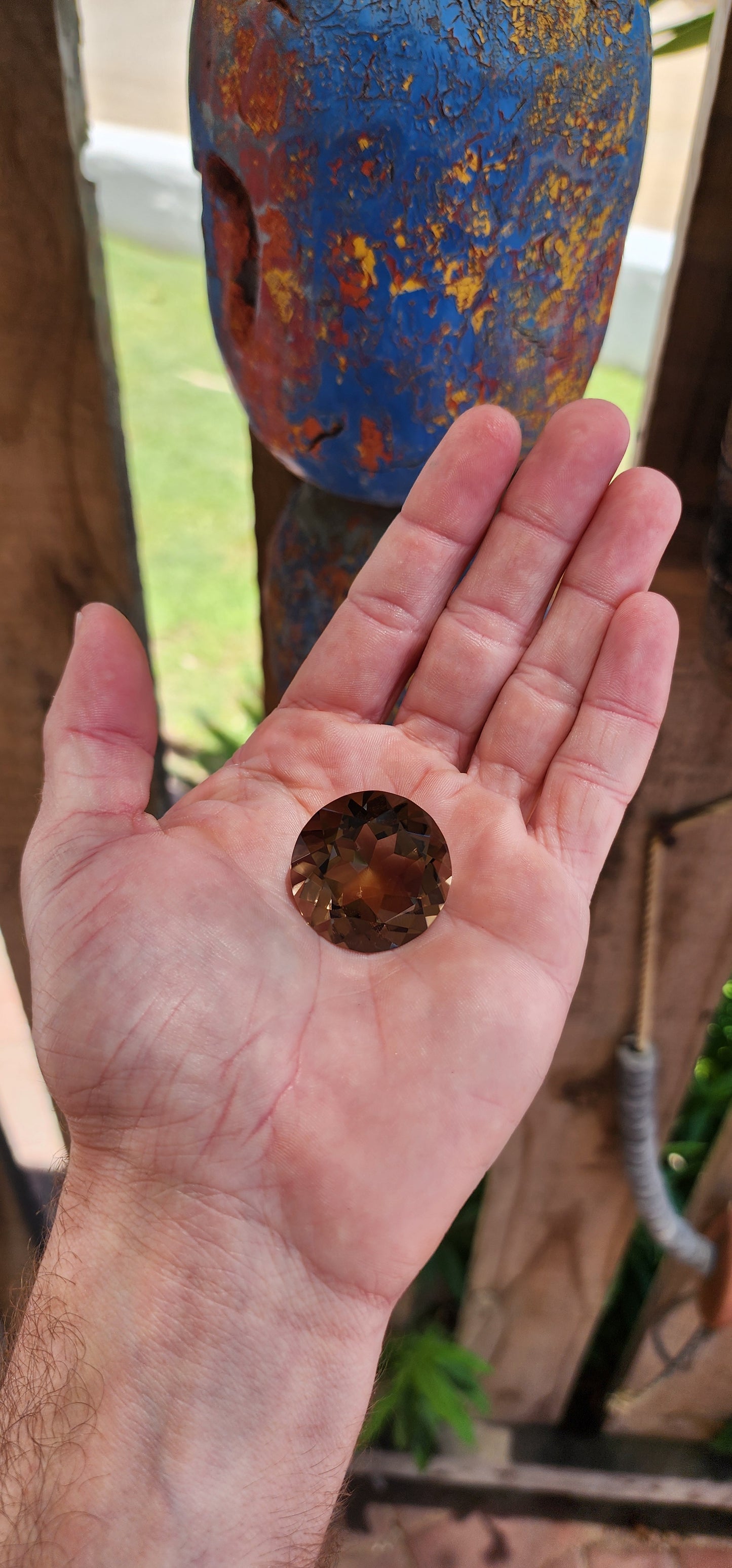 Very large unset natural smoky quartz gemstone, expertly faceted in a round brilliant cut to maximize its brilliance and luster.