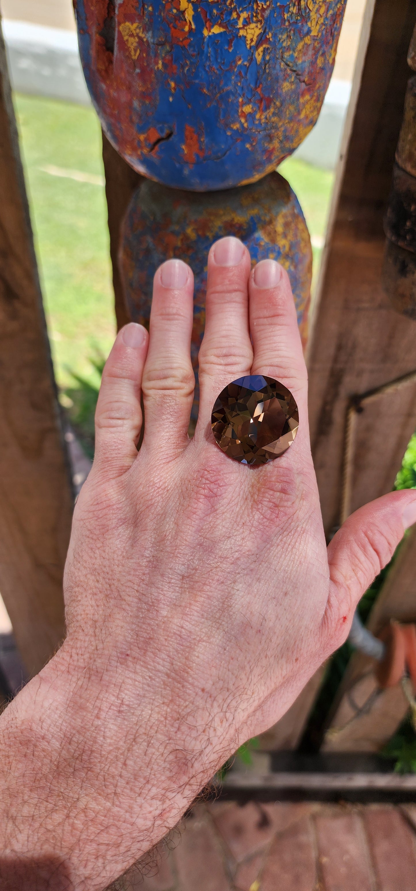 Very large unset natural smoky quartz gemstone, expertly faceted in a round brilliant cut to maximize its brilliance and luster.