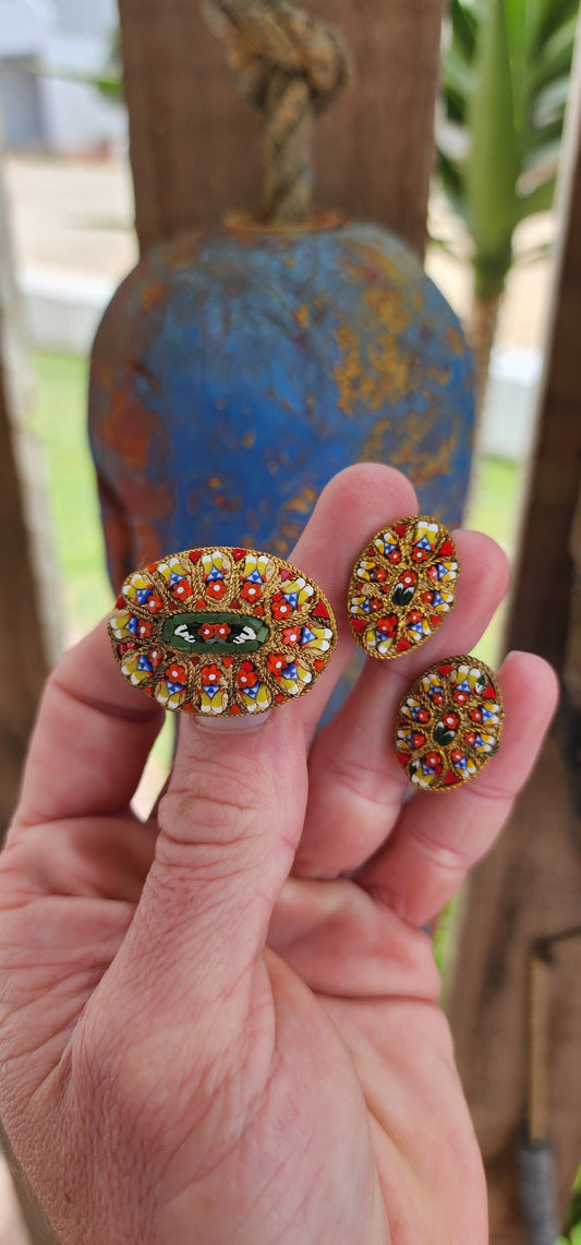 Beautiful vintage circa 1960's Italian micromosaic jewelry, consisting of an oval brooch and matching clip-on earrings.