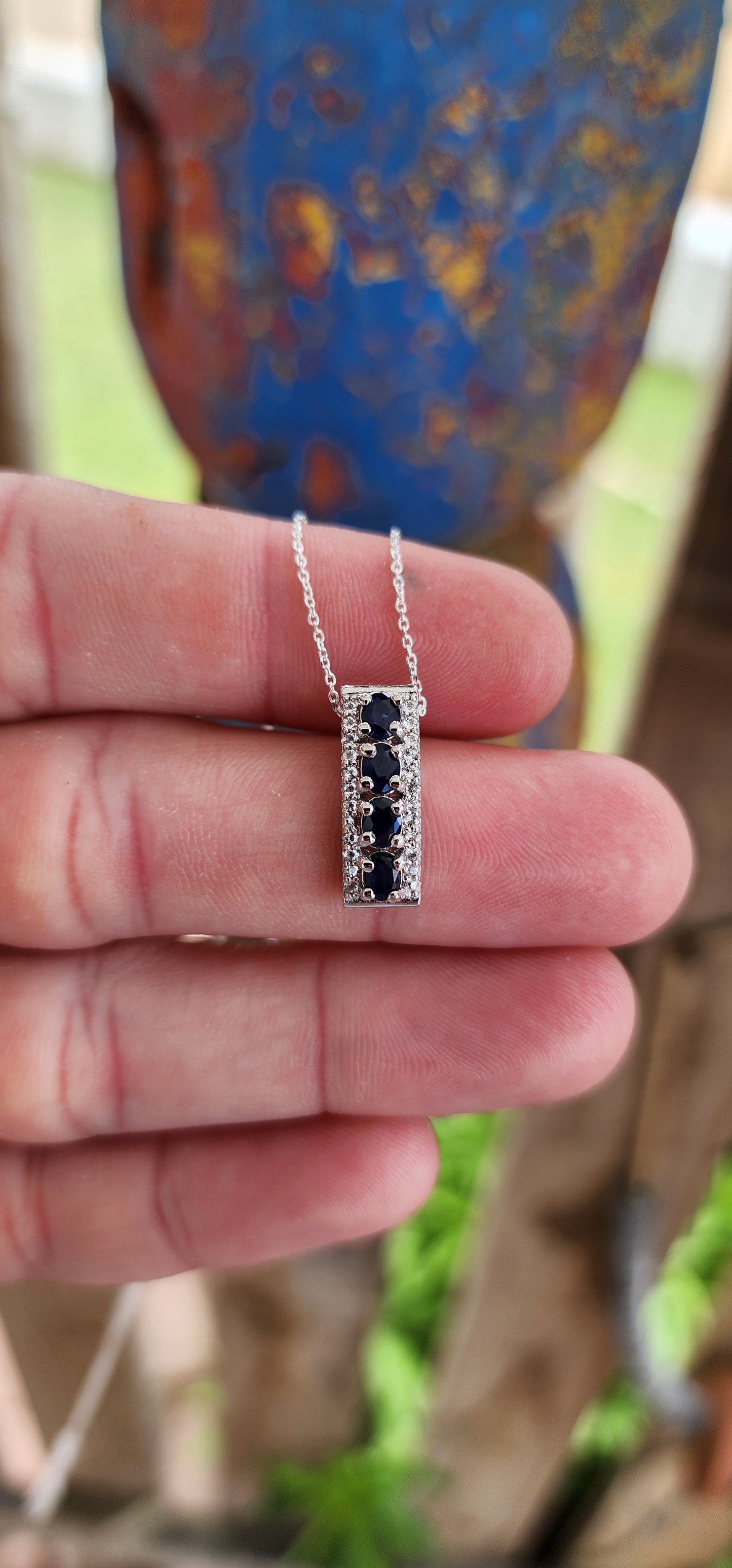 What a striking piece! This sterling silver rectangular pendant radiates an air of minimalist sophistication while packing plenty of sparkle.