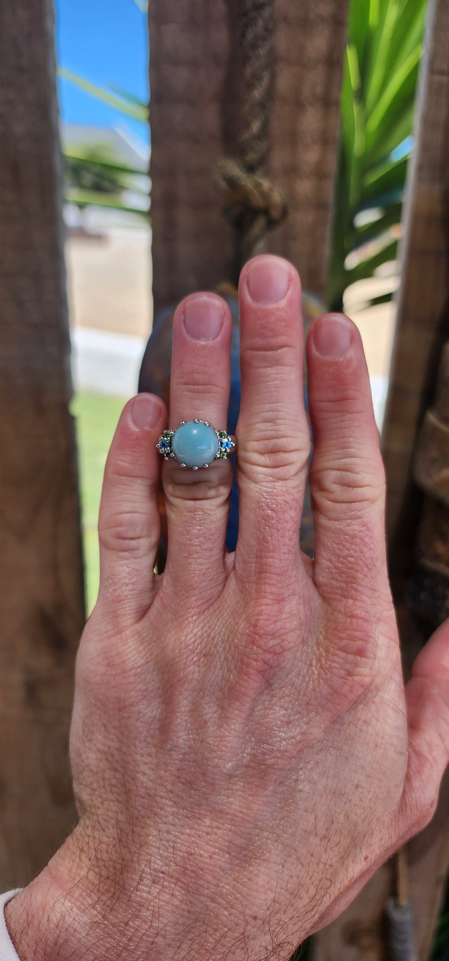 This chunky cocktail ring is like a treasure pulled straight from a mythical ocean's depths. Its sterling silver band gleams like moonlight on water, holding court to a mesmerizing round chalcedony cabochon.