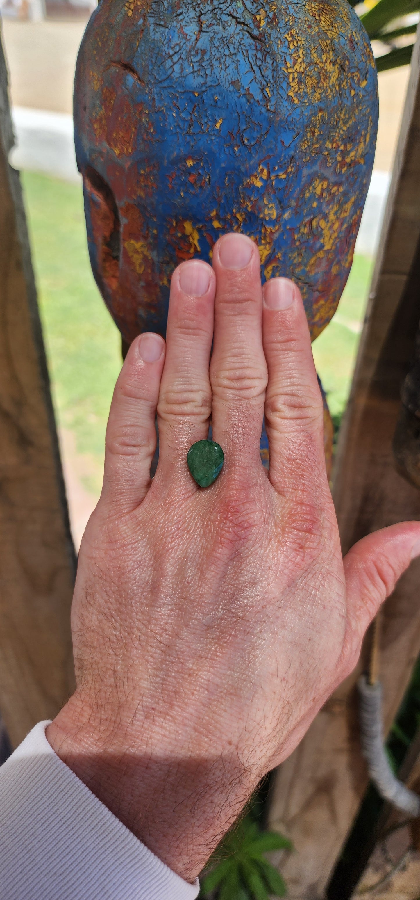 Natural unset 8.5-carat Zambian emerald gemstone in a pear cut with an opaque clarity.