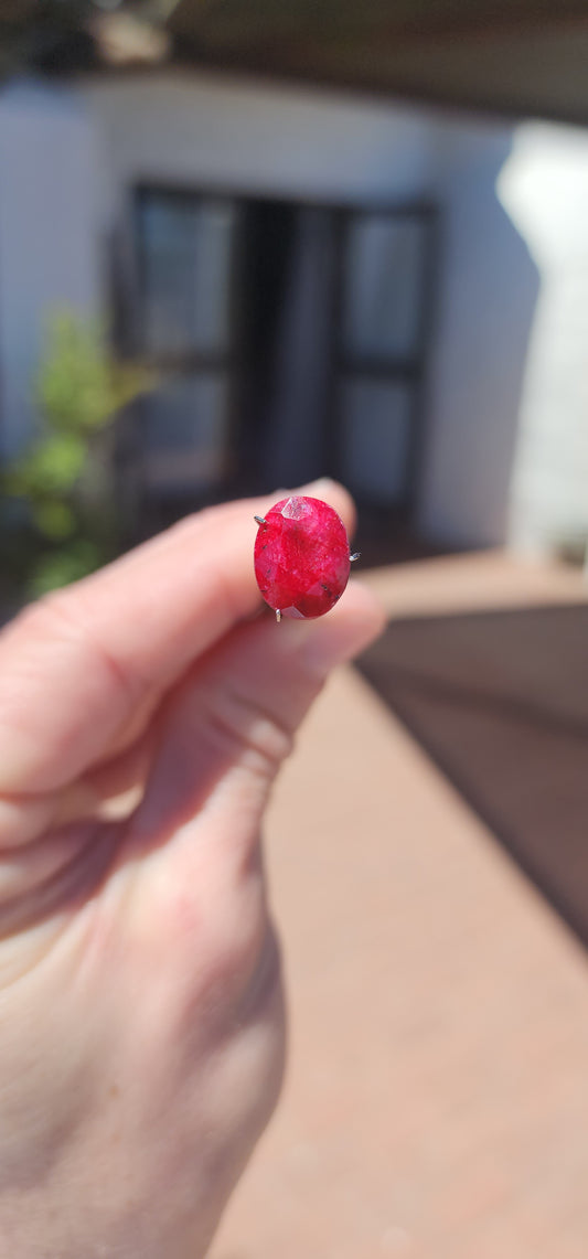 Natural and treated unset 7ct Mozambique Ruby gemstone in a oval cut with opaque clarity.