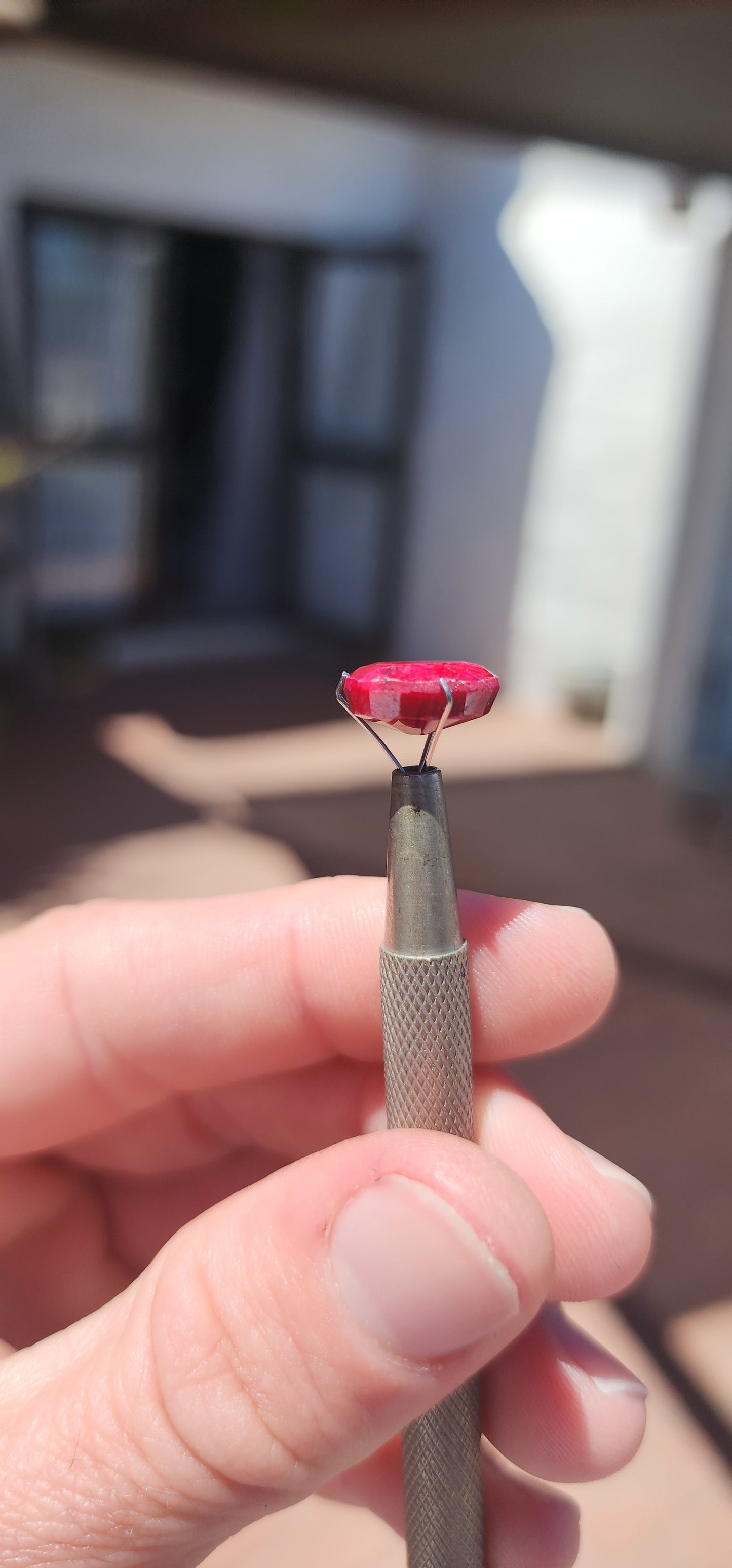 Natural and treated unset 7ct Mozambique Ruby gemstone in a oval cut with opaque clarity.