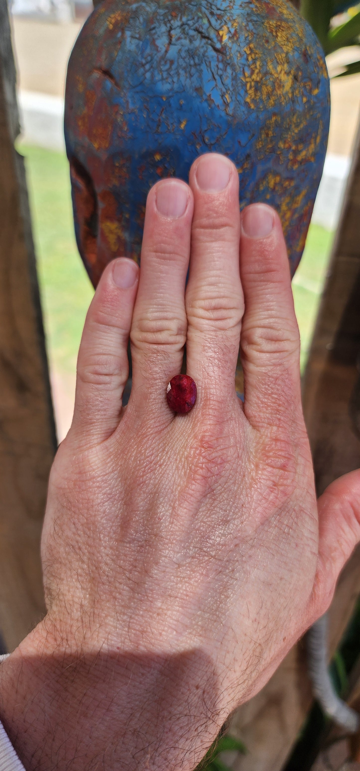 Natural and treated unset 7ct Mozambique Ruby gemstone in a oval cut with opaque clarity.