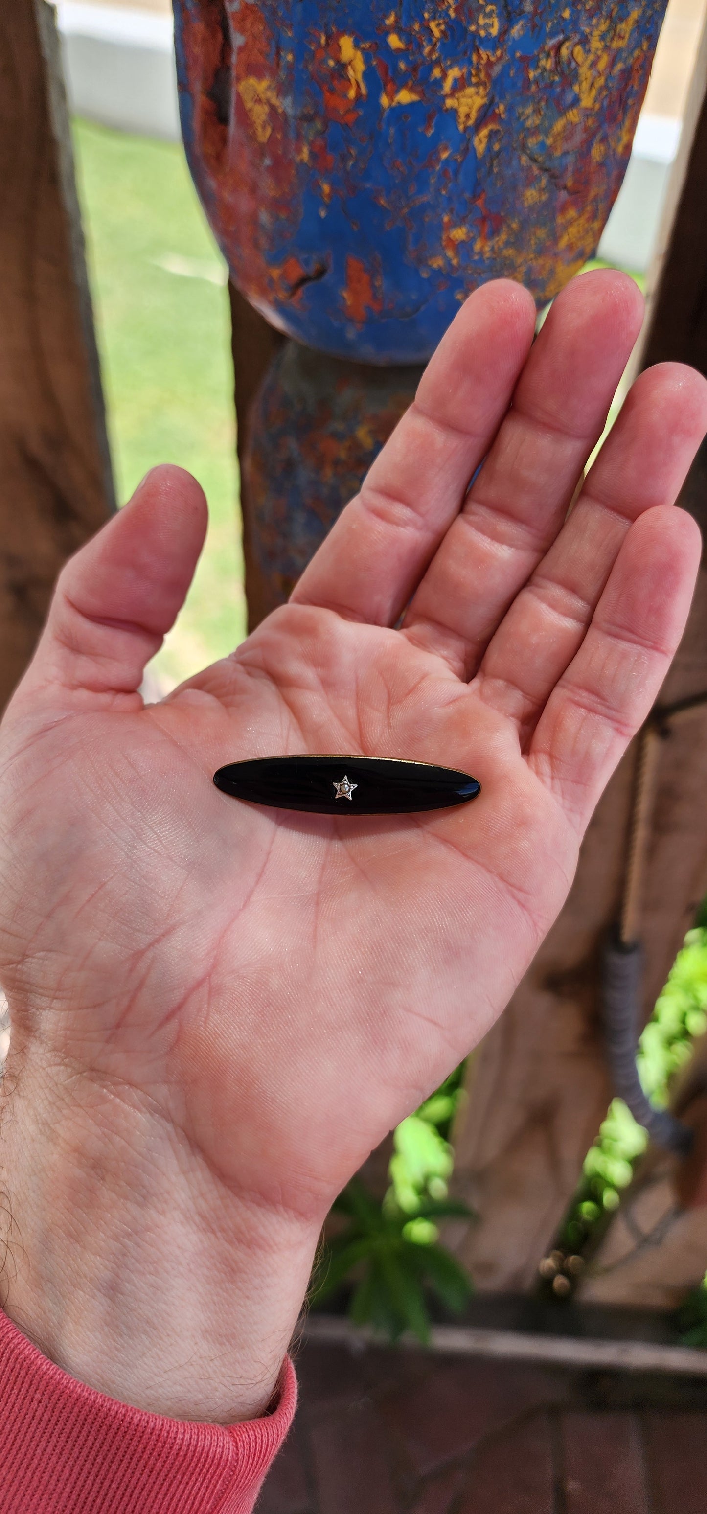 This brooch is a fine example of antique Victorian mourning jewelry, dating to the late 19th to early 20th century.