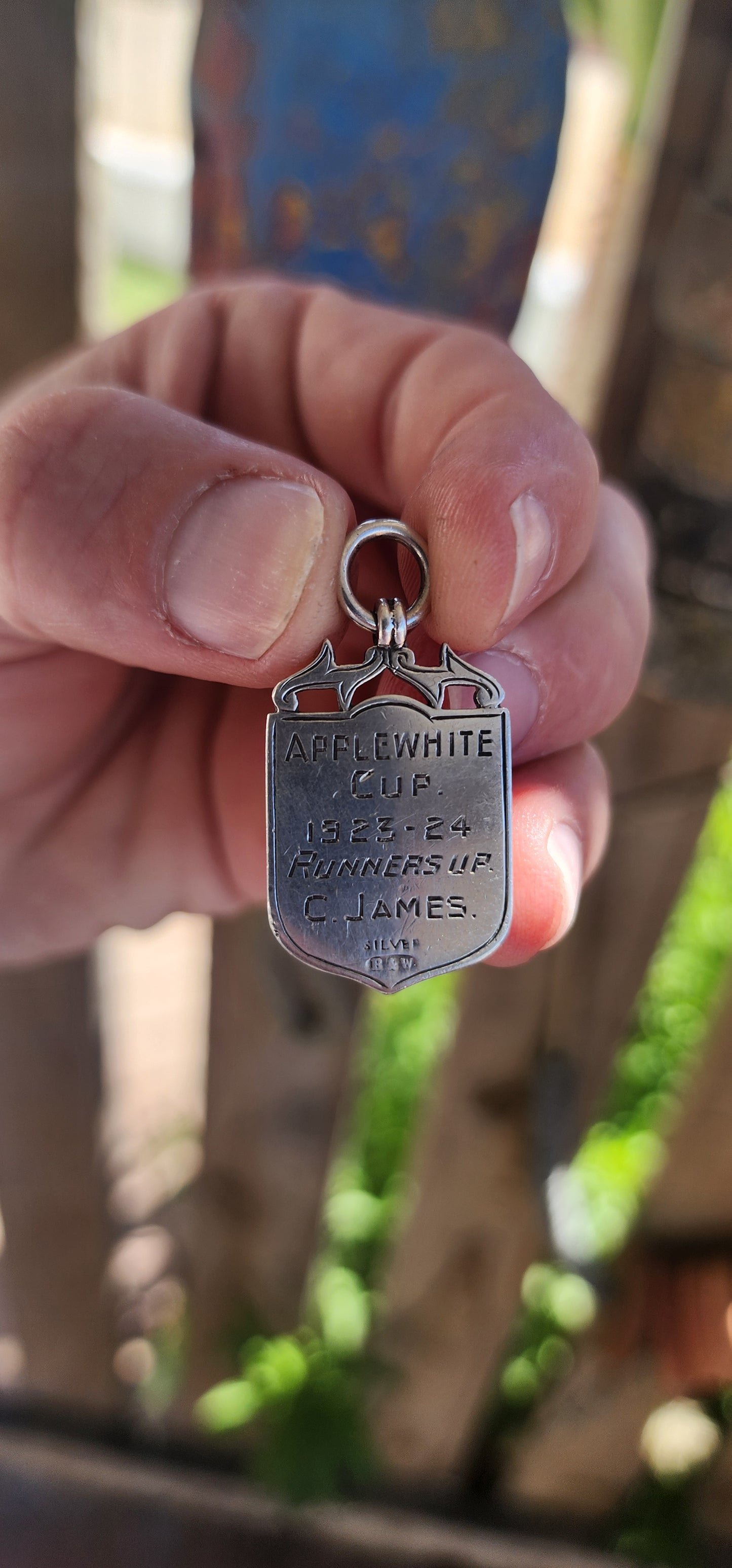 Antique fob shield pendant dating to the early 20th century (1923-24), made from hallmarked sterling silver and 9ct rose gold.