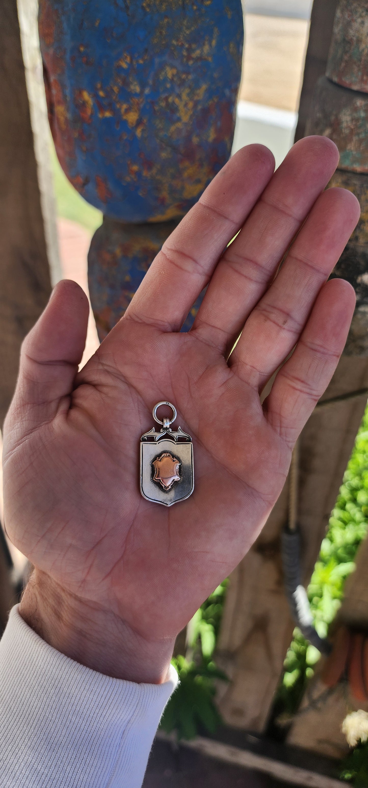 Antique fob shield pendant dating to the early 20th century (1923-24), made from hallmarked sterling silver and 9ct rose gold.