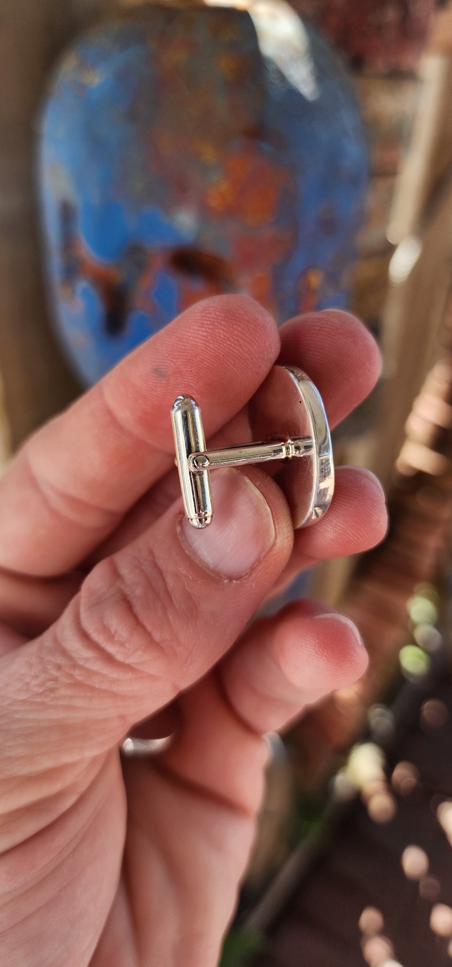 These are sterling silver cufflinks featuring hardened sea urchin shells, crafted by the South African jewelry designer Kinkel Jewellery.