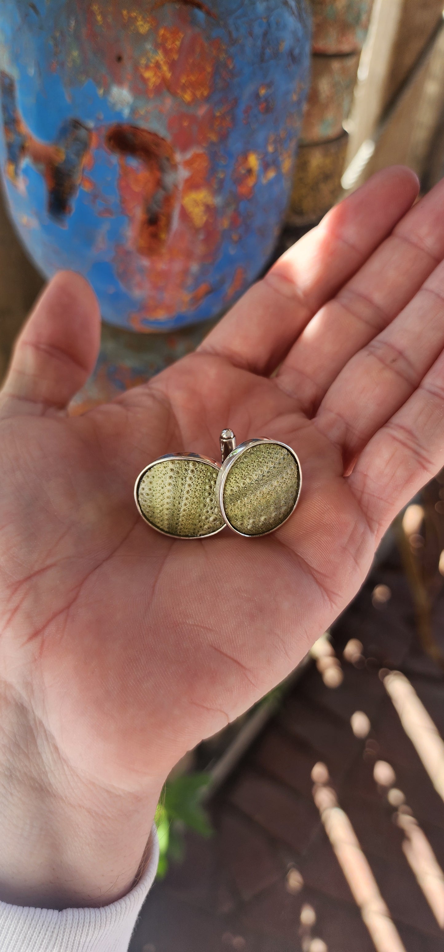 These are sterling silver cufflinks featuring hardened sea urchin shells, crafted by the South African jewelry designer Kinkel Jewellery.