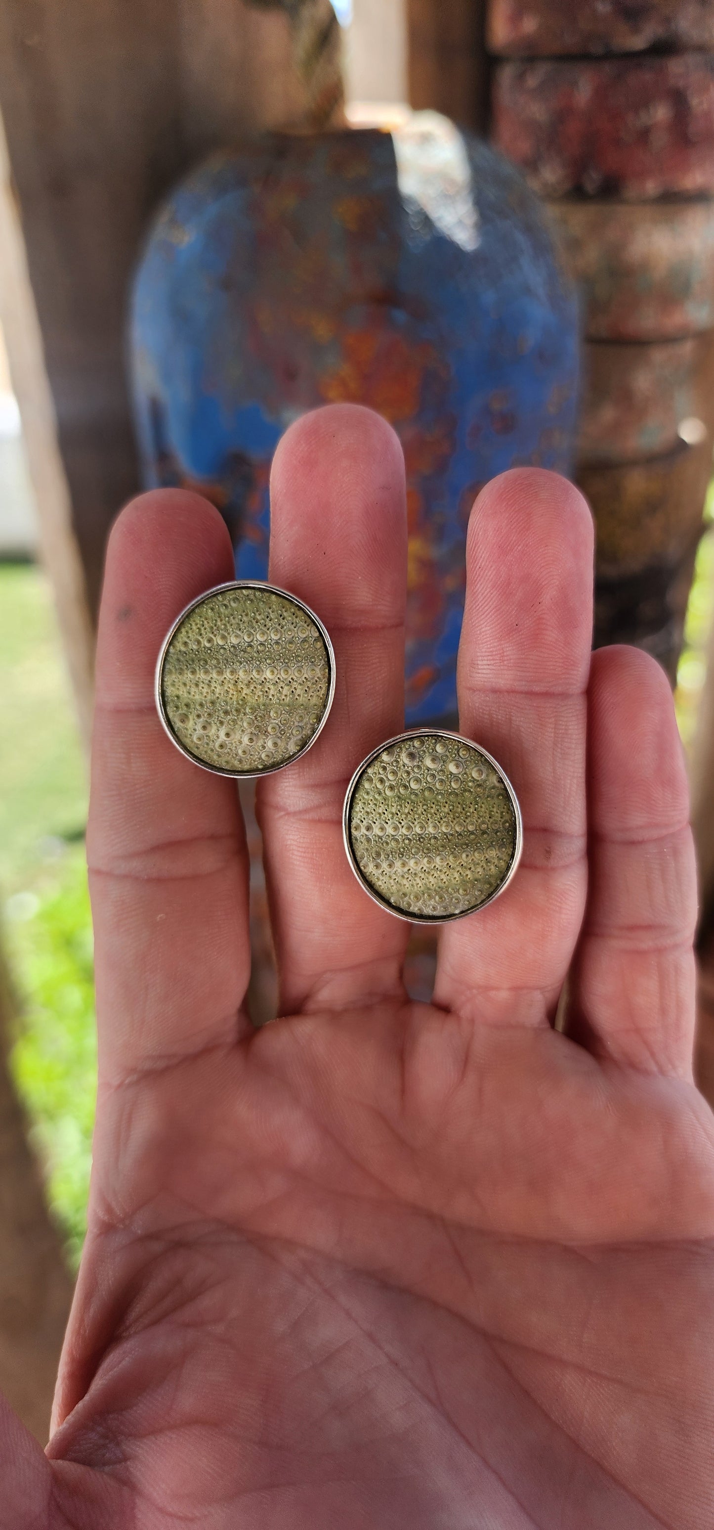 These are sterling silver cufflinks featuring hardened sea urchin shells, crafted by the South African jewelry designer Kinkel Jewellery.