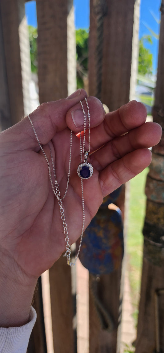 This pendant is a harmonious blend of modern sophistication and timeless elegance, meticulously crafted in sterling silver. At its heart lies a stunning oval-cut tanzanite gemstone.