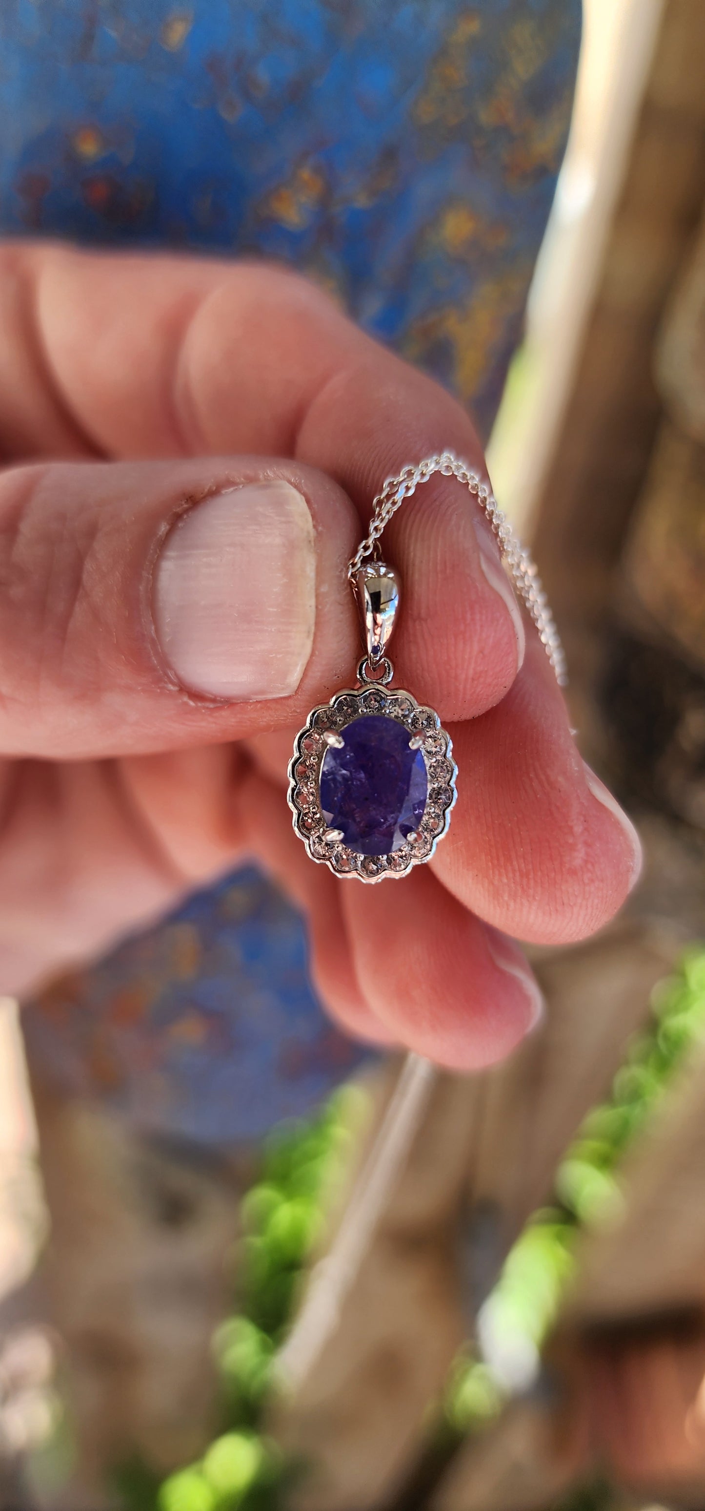 This pendant is a harmonious blend of modern sophistication and timeless elegance, meticulously crafted in sterling silver. At its heart lies a stunning oval-cut tanzanite gemstone.