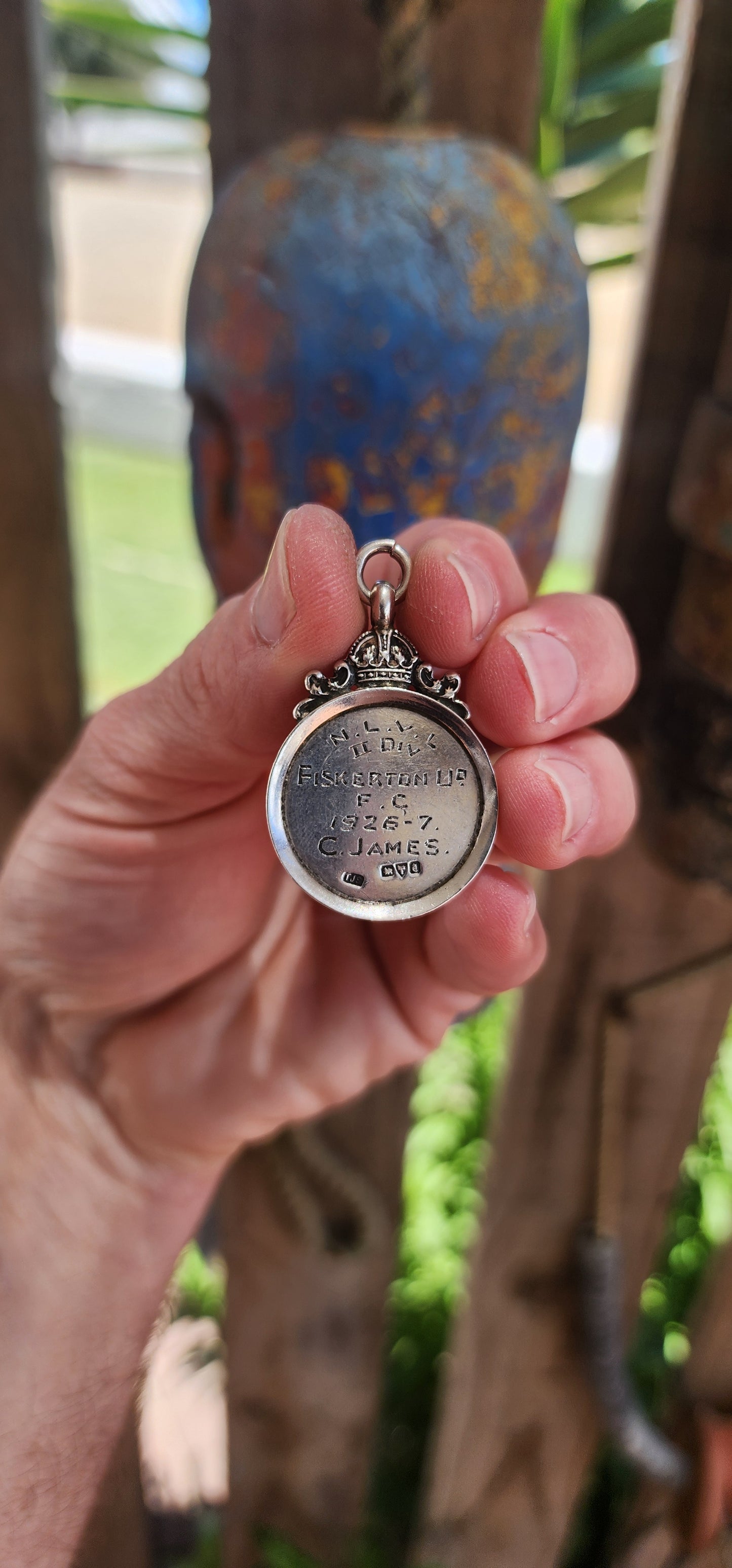 Hallmarked sterling silver and rose gold "crown" fob shield pendant.