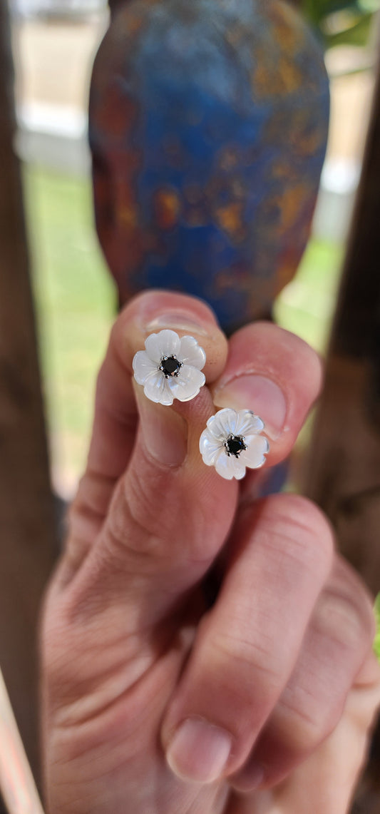 These stud earrings are like delicate little blooms frozen in time, a perfect mix of nature’s grace and a dash of glamour. Each one is a miniature garden on your ears—tiny Burnet Roses carved from shimmering Mother of Pearl with Black Diamonds.