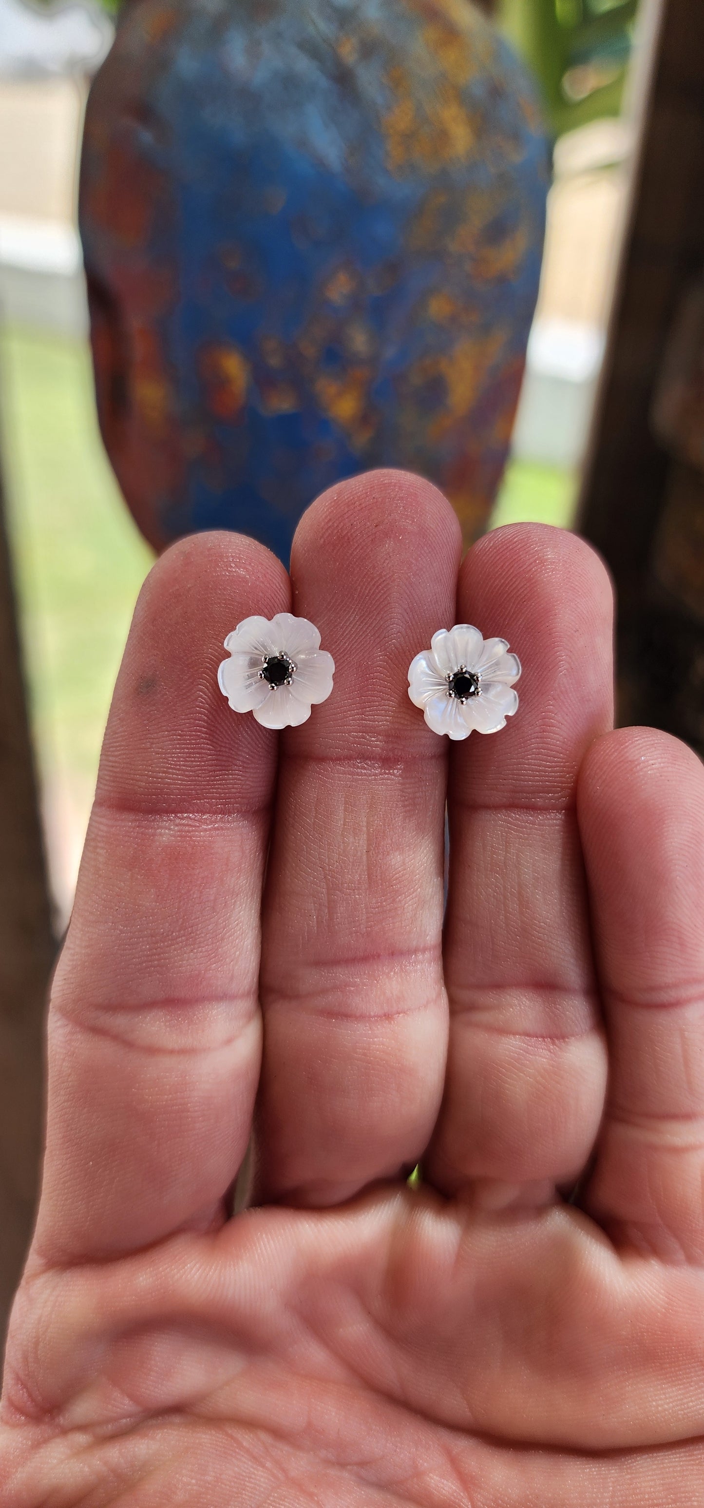 These stud earrings are like delicate little blooms frozen in time, a perfect mix of nature’s grace and a dash of glamour. Each one is a miniature garden on your ears—tiny Burnet Roses carved from shimmering Mother of Pearl with Black Diamonds.