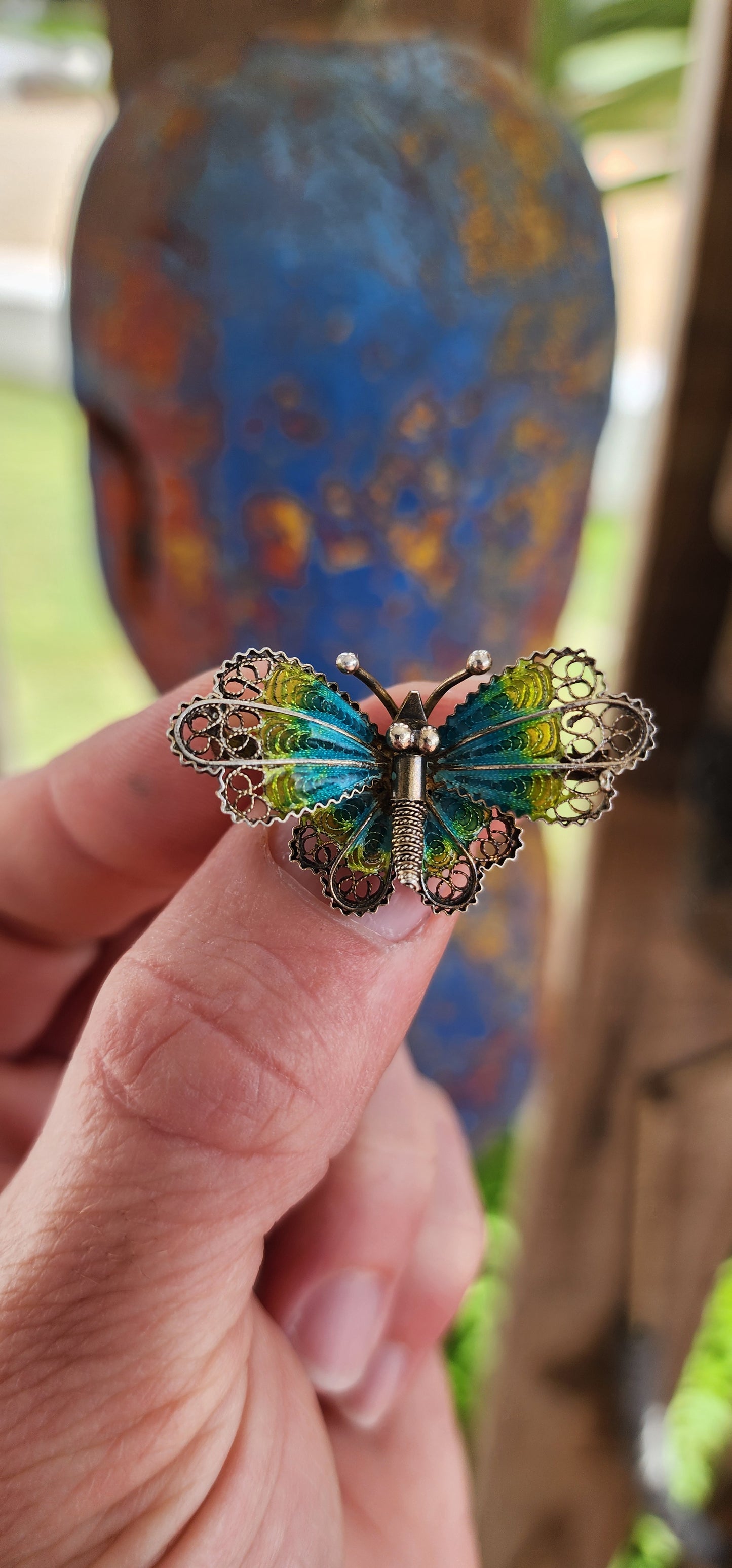 This vintage 800 silver butterfly brooch is a miniature masterpiece of craftsmanship, radiating timeless charm. The body of the butterfly is delicately sculpted in silver, featuring a textured abdomen and tiny antennae that add lifelike detail.