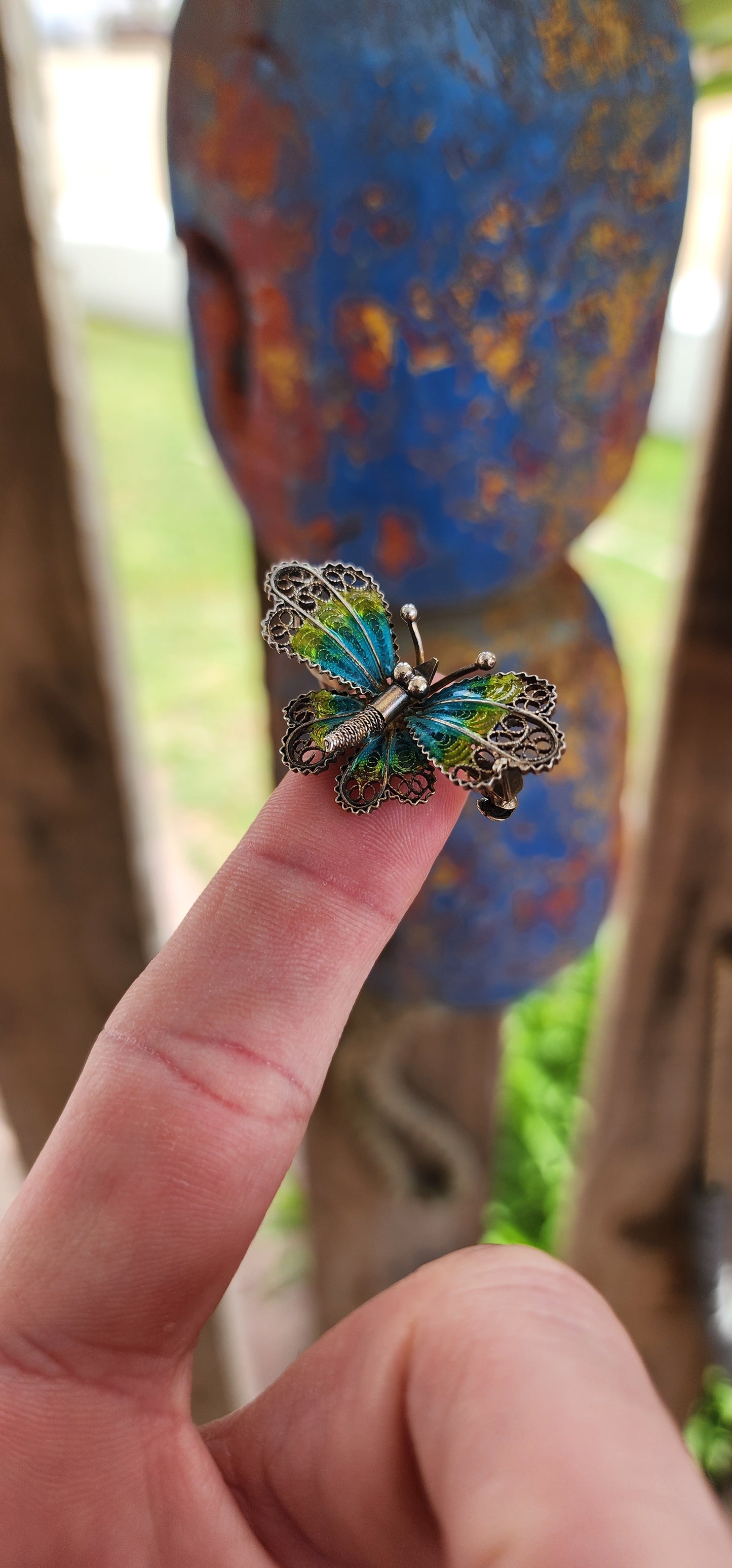 This vintage 800 silver butterfly brooch is a miniature masterpiece of craftsmanship, radiating timeless charm. The body of the butterfly is delicately sculpted in silver, featuring a textured abdomen and tiny antennae that add lifelike detail.