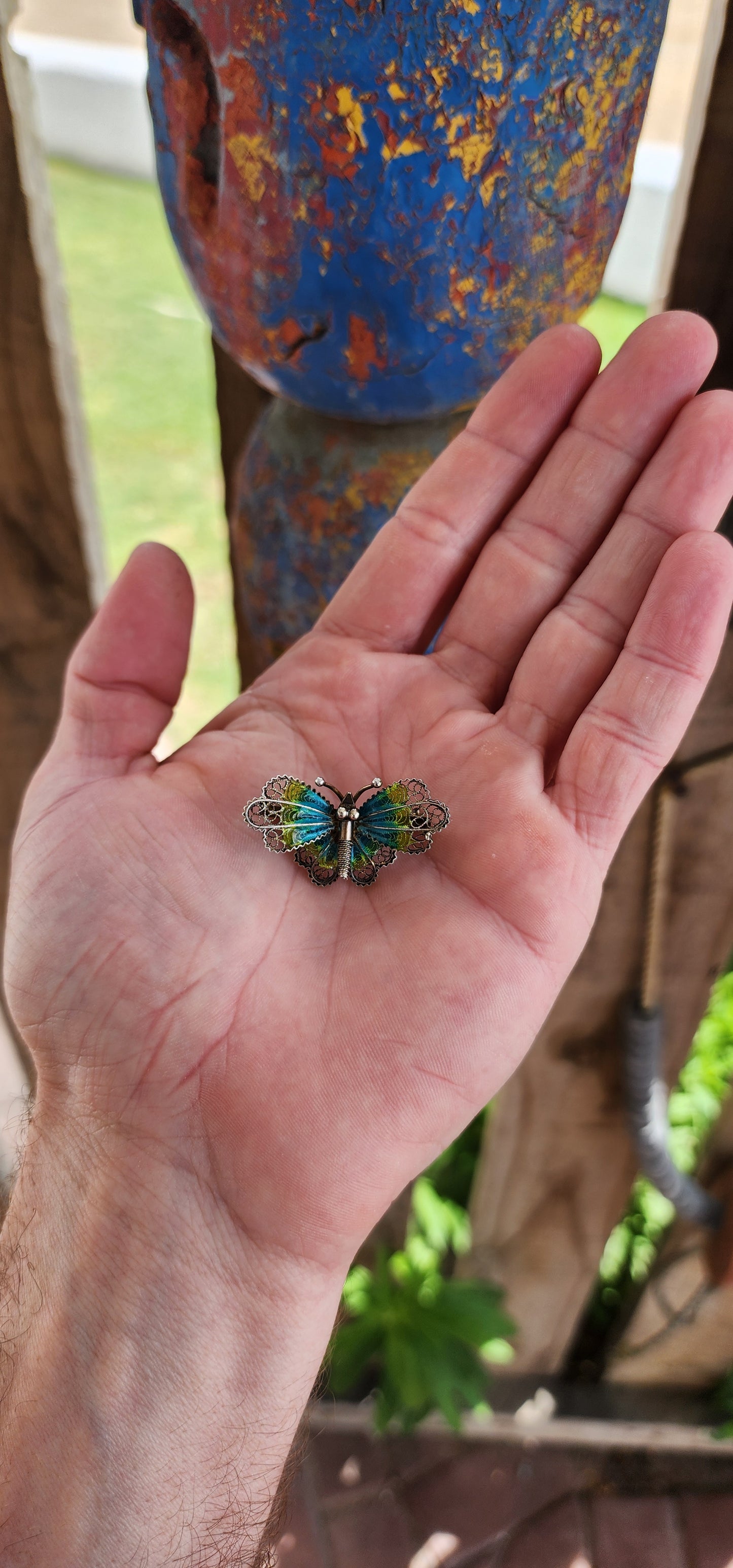 This vintage 800 silver butterfly brooch is a miniature masterpiece of craftsmanship, radiating timeless charm. The body of the butterfly is delicately sculpted in silver, featuring a textured abdomen and tiny antennae that add lifelike detail.