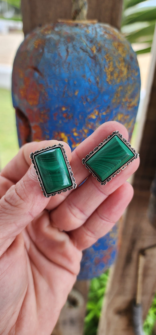 Why settle for one when you can have a dazzling duo?Twinsies!!!These vintage sterling silver and malachite cabochon brooches are pure elegance times two!