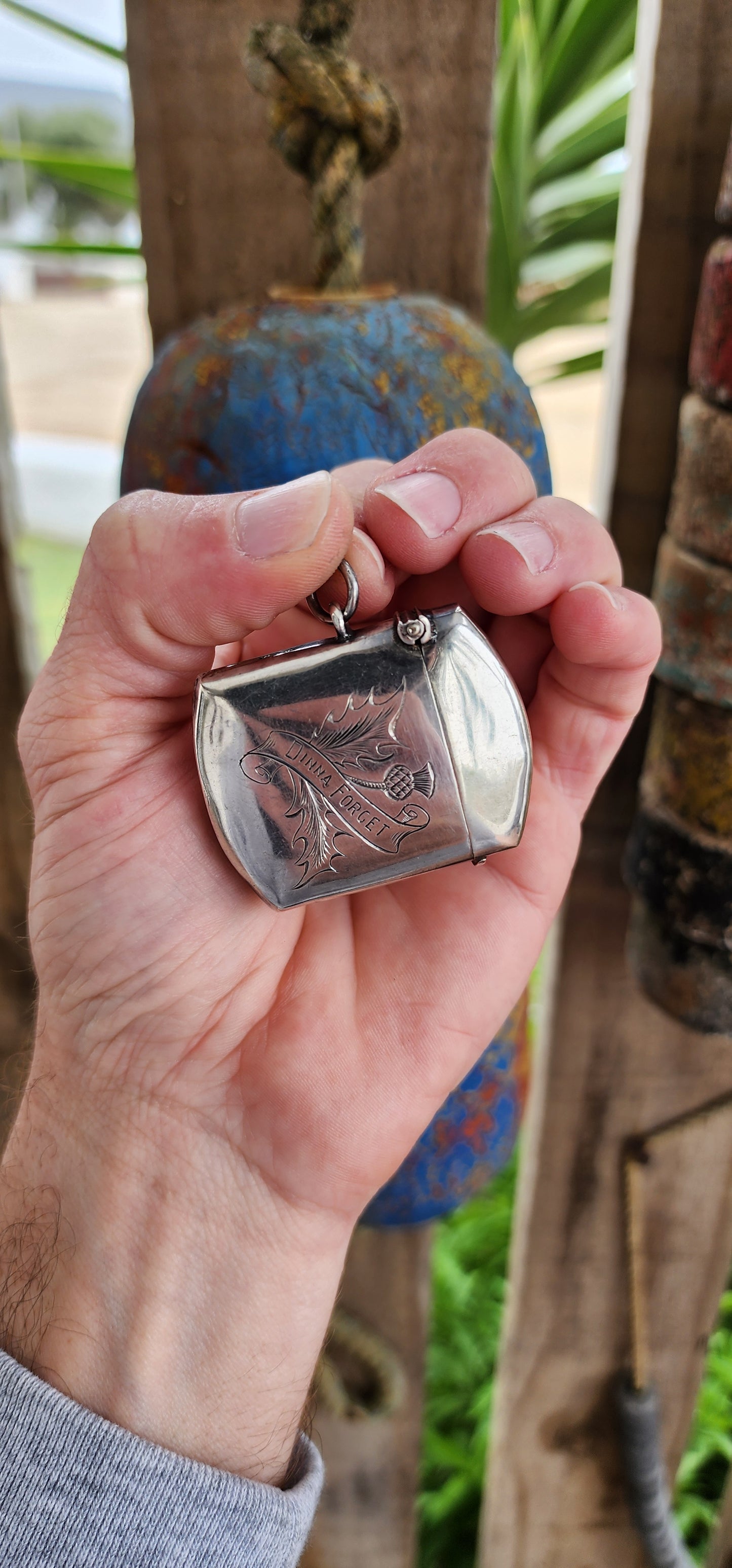 This Edwardian sterling silver vesta case, crafted by William Hair Haseler and hallmarked in Birmingham circa 1908, is a prime example of the intersection between functional design, symbolic artistry, and cultural heritage.