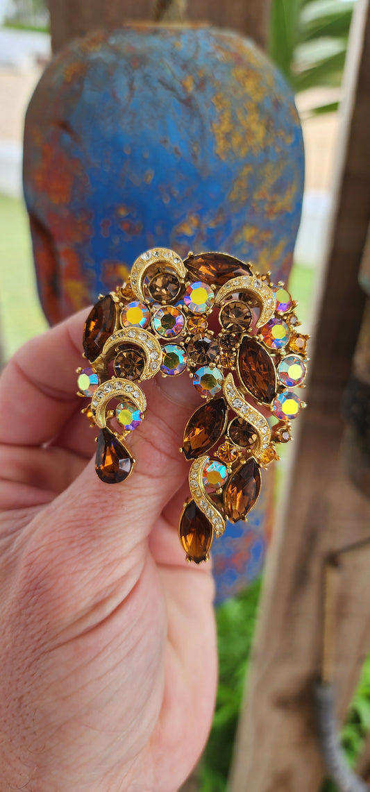 This large statement brooch is a vintage circa 1950s designer costume piece by Sphinx, a British jewelry manufacturer renowned for high-quality, mid-century costume jewelry.Signed accordingly.