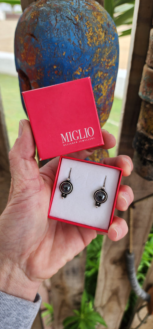 Pair of designer costume earrings by Miglio,crafted with care and elegance.