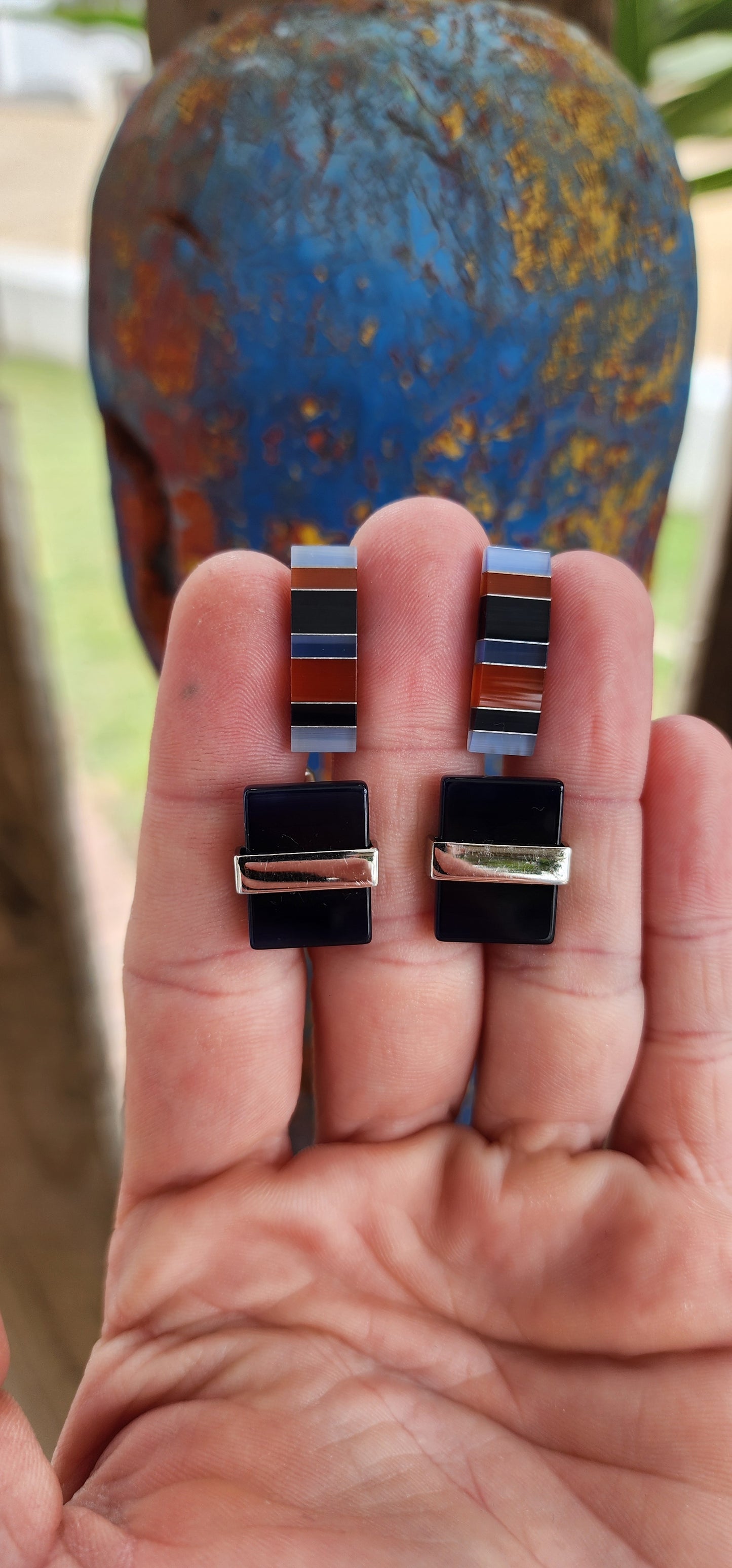 Two pairs of stainless steel and glass components cufflinks, elegantly designed in a art deco style.