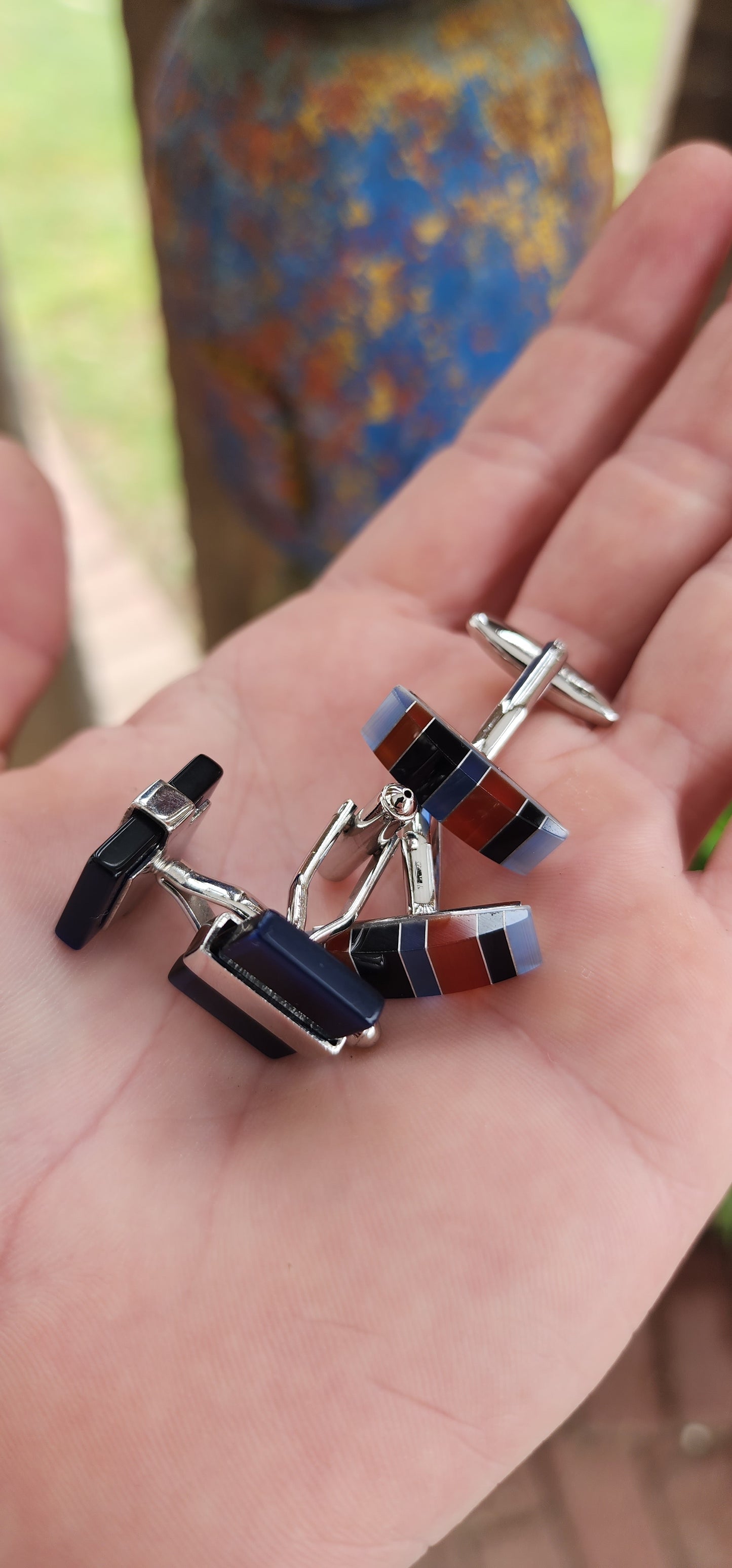 Two pairs of stainless steel and glass components cufflinks, elegantly designed in a art deco style.