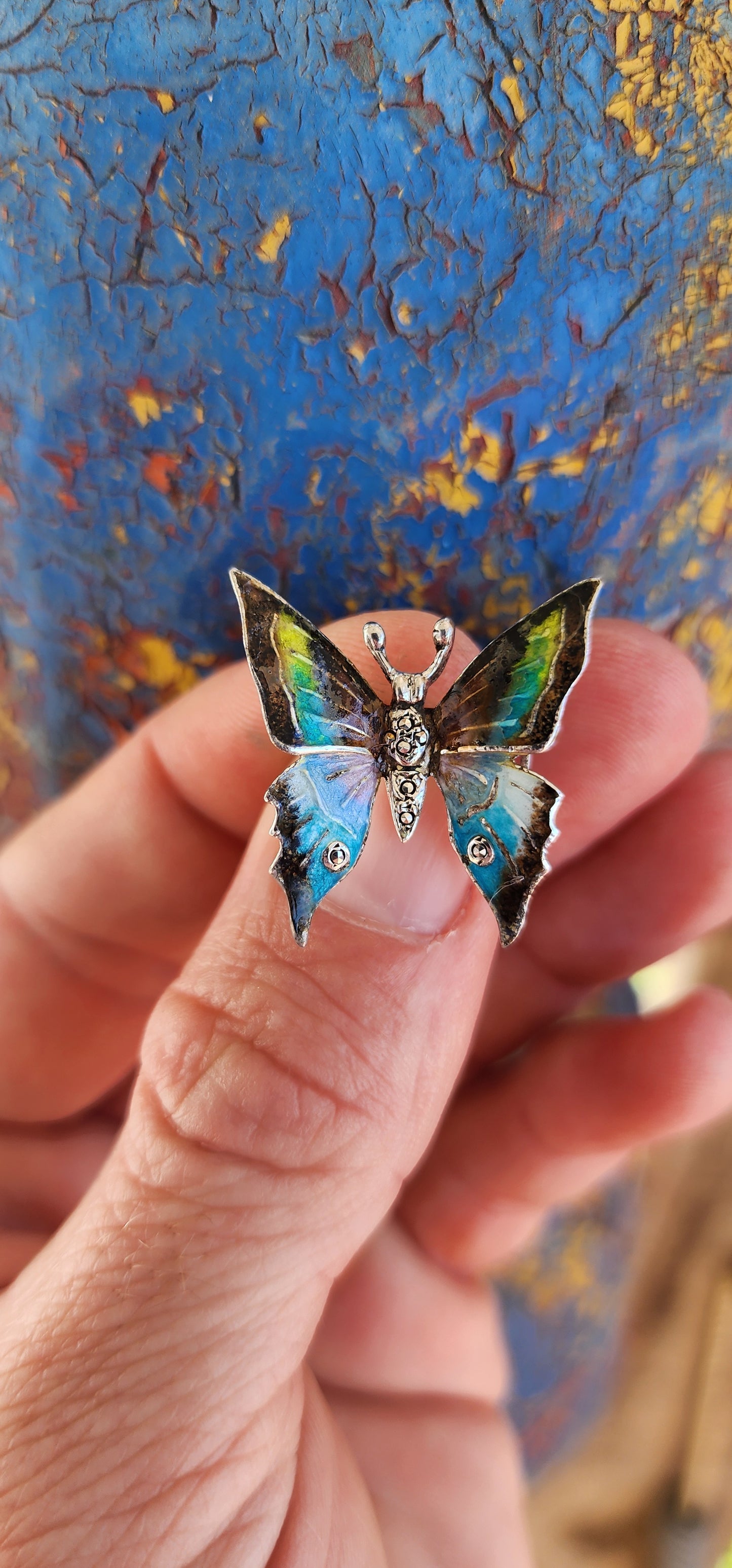 This vintage sterling silver butterfly brooch is a breathtaking work of art, brimming with character and charm. Made in Germany, it showcases the fine craftsmanship and attention to detail characteristic of classic European jewelry.