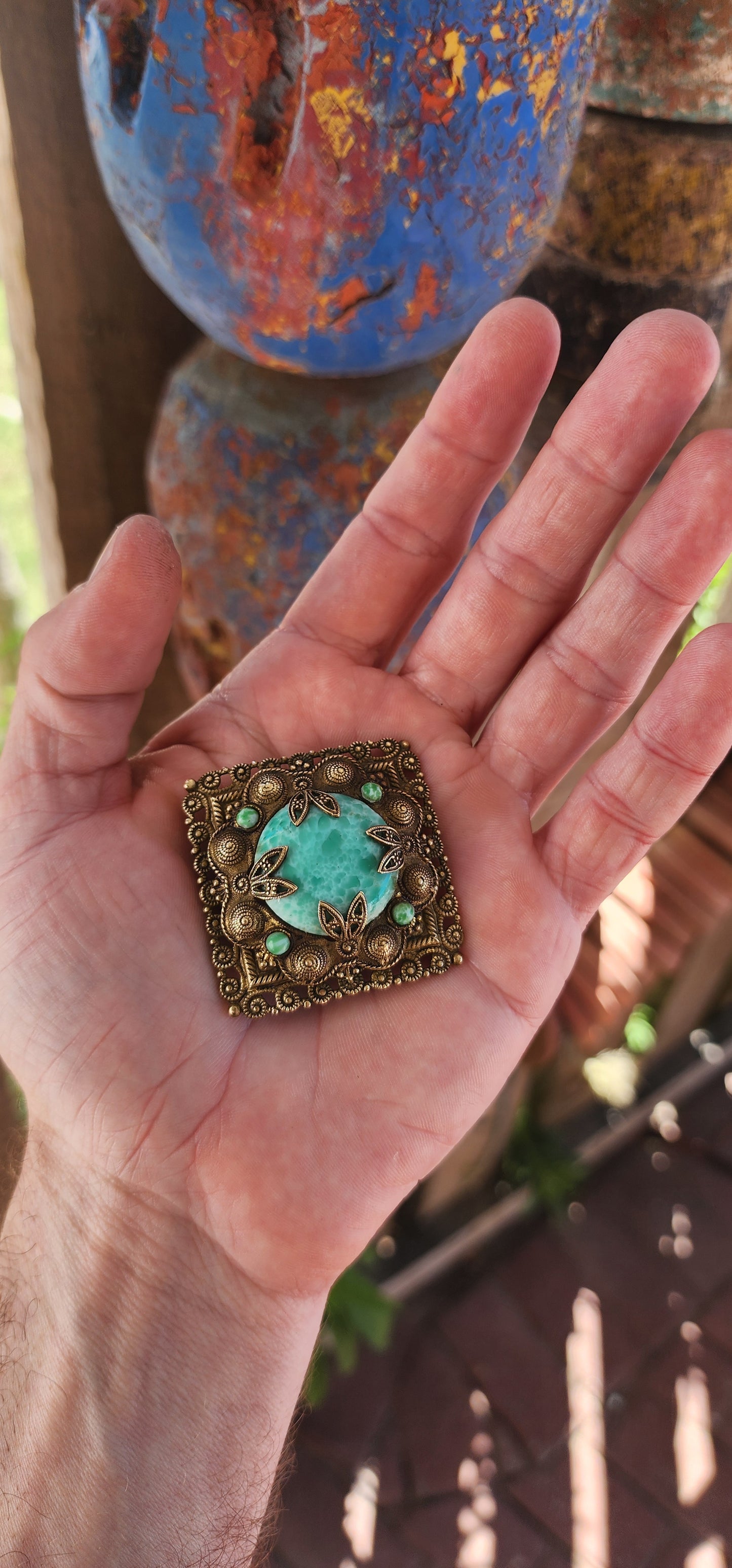 This brooch is an exquisite piece of vintage costume jewelry, crafted in the 1930s in the distinct style of Czech ornamental design. It showcases the exceptional attention to detail and artistic quality characteristic of Czech jewelry from this era.