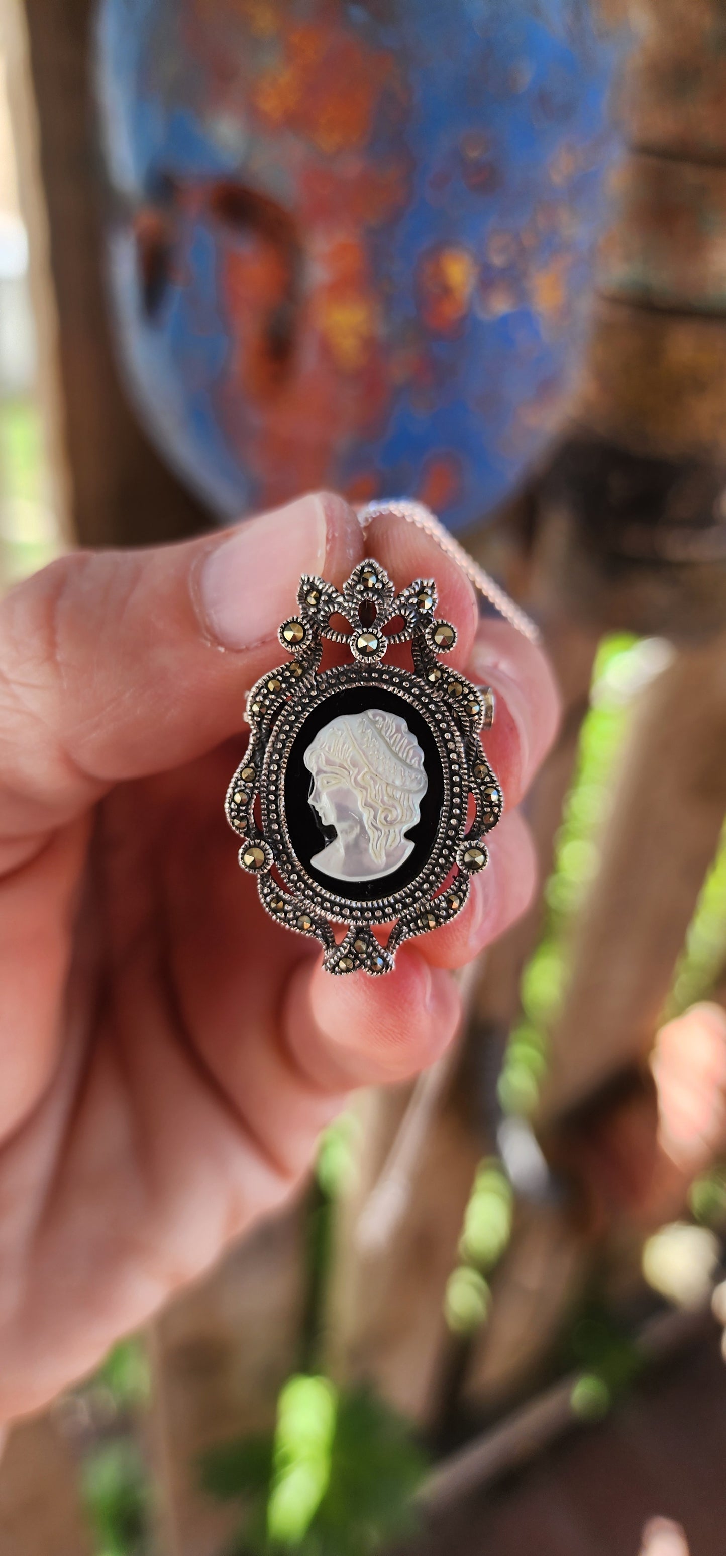 This sterling silver cameo pendant/brooch is a dazzling creation that perfectly captures the opulence of Victorian Revival jewelry.