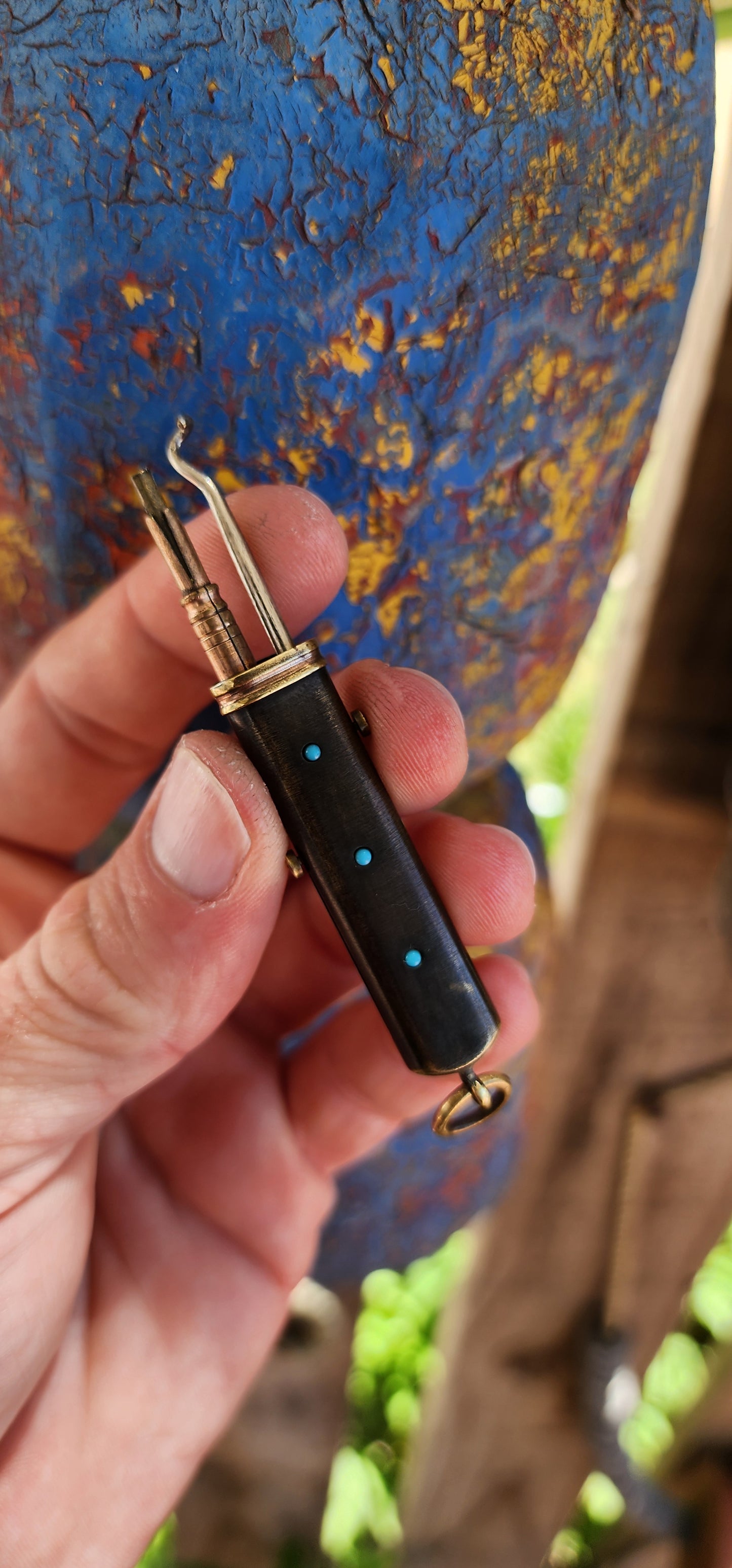 Rare find!This pendant is a remarkable Victorian-era brass multi-tool "etui" that embodies both function and ornamentation, typical of the late 19th to early 20th century.