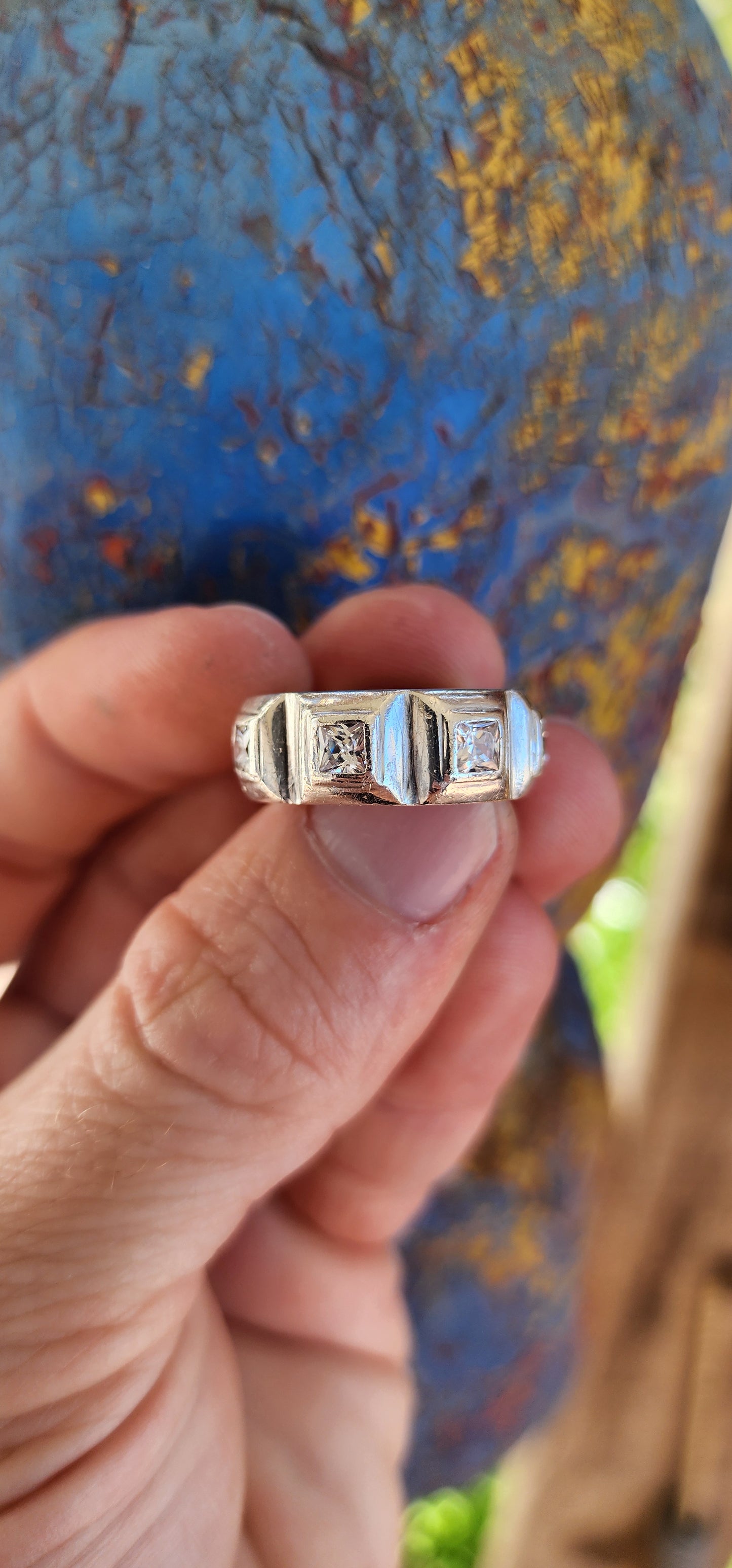 This gorgeous ring is a handcrafted, unisex sterling silver creation with a contemporary half-eternity style design. The band is substantial and chunky, showcasing a bold presence on the finger.