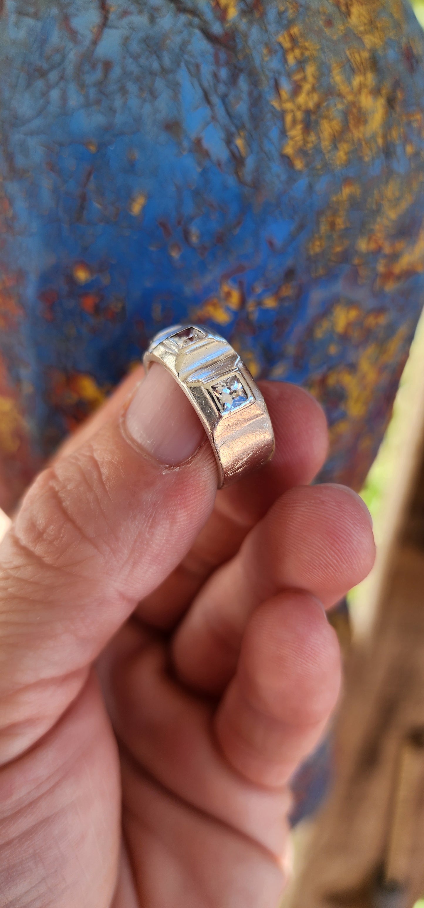 This gorgeous ring is a handcrafted, unisex sterling silver creation with a contemporary half-eternity style design. The band is substantial and chunky, showcasing a bold presence on the finger.