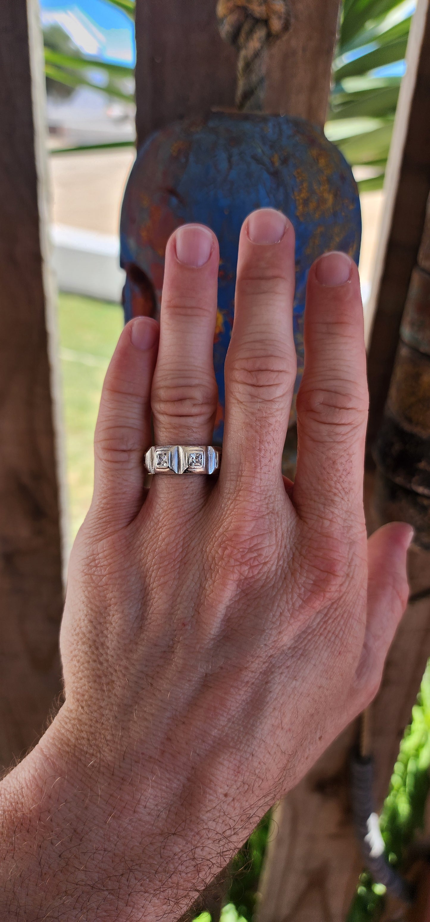 This gorgeous ring is a handcrafted, unisex sterling silver creation with a contemporary half-eternity style design. The band is substantial and chunky, showcasing a bold presence on the finger.