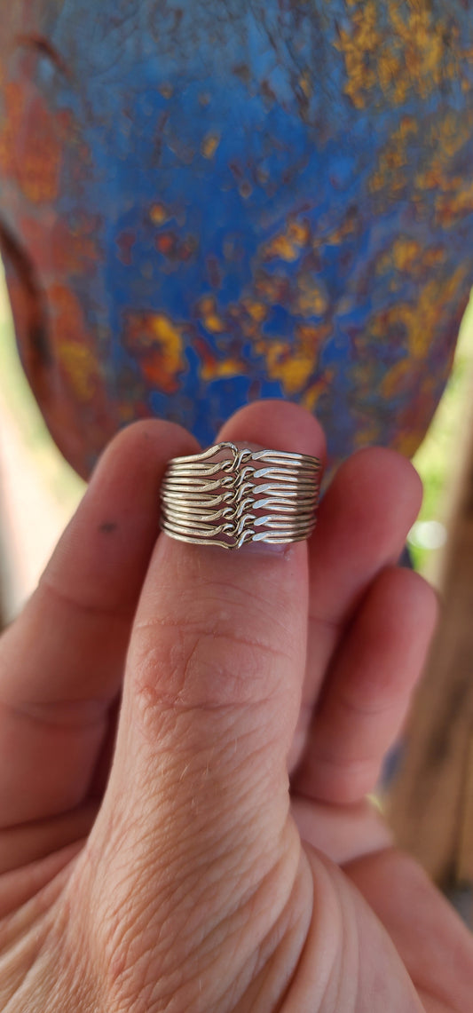 Vintage sterling silver 12-band interlocking puzzle ring, an intricate piece of jewelry with a long history and deep cultural significance.