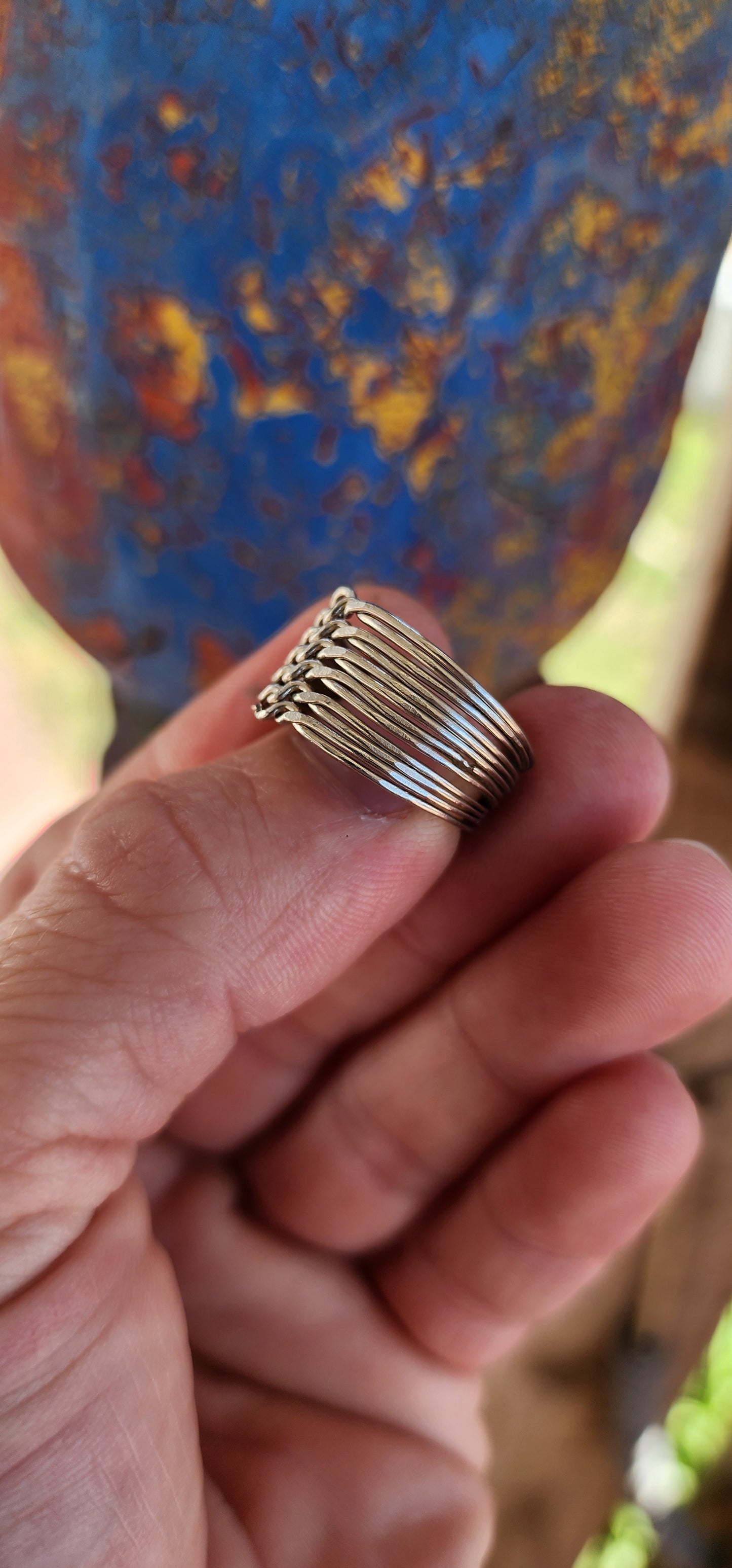 Vintage sterling silver 12-band interlocking puzzle ring, an intricate piece of jewelry with a long history and deep cultural significance.