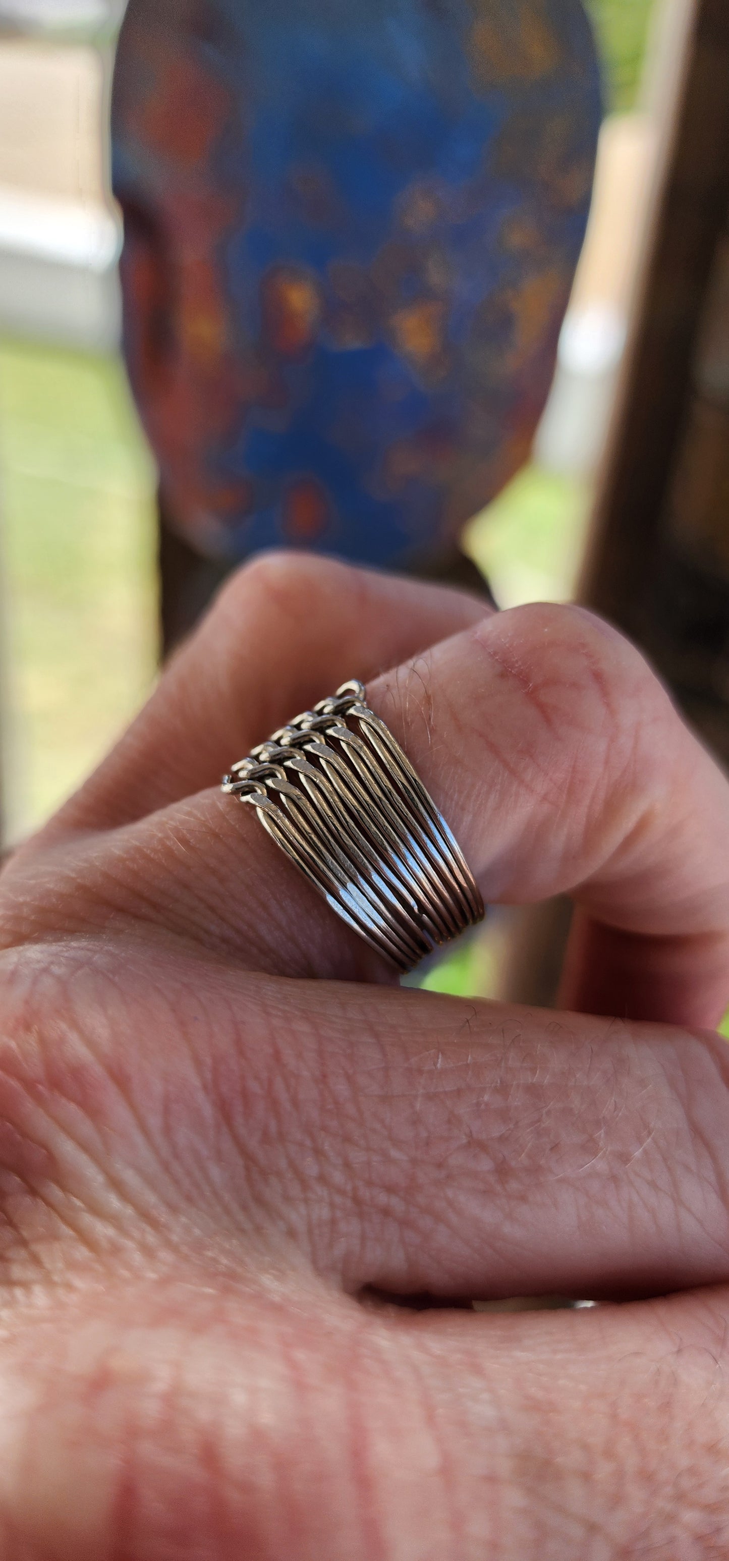 Vintage sterling silver 12-band interlocking puzzle ring, an intricate piece of jewelry with a long history and deep cultural significance.