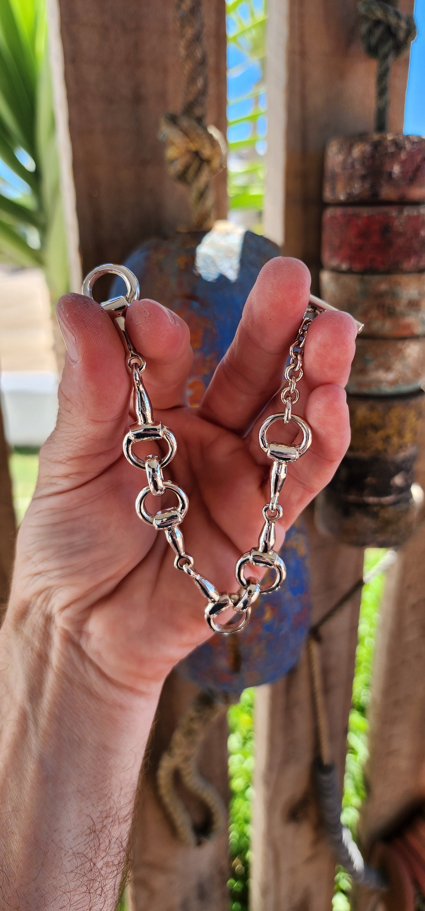 This bracelet is the ultimate showstopper for equestrian enthusiasts and lovers of bold, timeless jewelry. Crafted from chunky, weighty solid sterling silver, it features an intricate design inspired by horse snaffle bits.