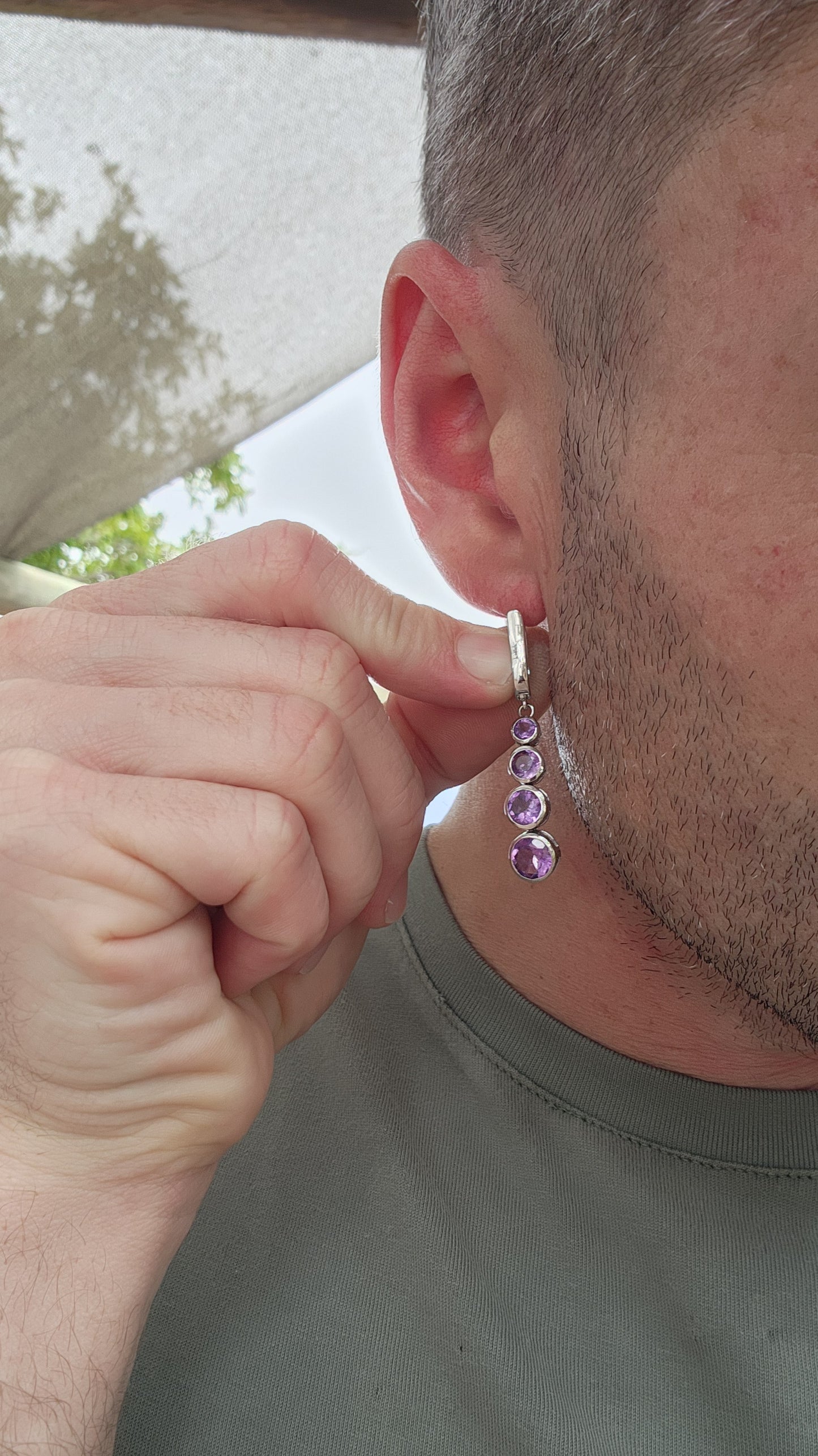 These sterling silver drop earrings are absolutely beautiful. Each earring features four bezel-set, round-cut amethysts arranged in a graduated design that seamlessly transitions from smaller stones at the top to larger ones at the base.