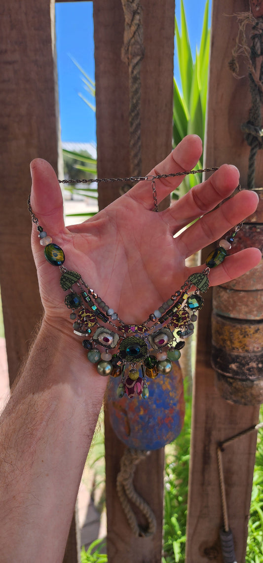 This Ayala Bar handmade statement necklace is a bold and intricate piece that showcases the designer’s artistic mastery and attention to detail.