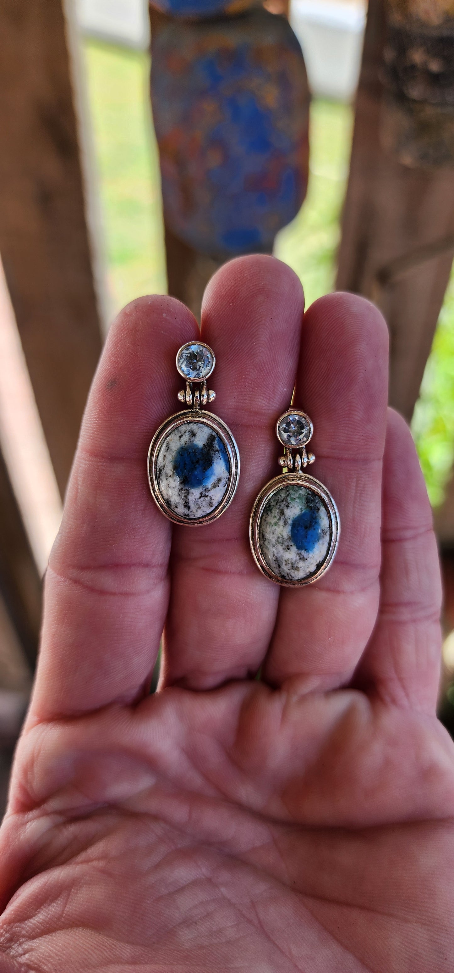 These gorgeous push-in dangle earrings feature a striking, vintage-inspired design, showcasing sky-blue Topaz and rare K2 Jasper in bezel/tube settings.