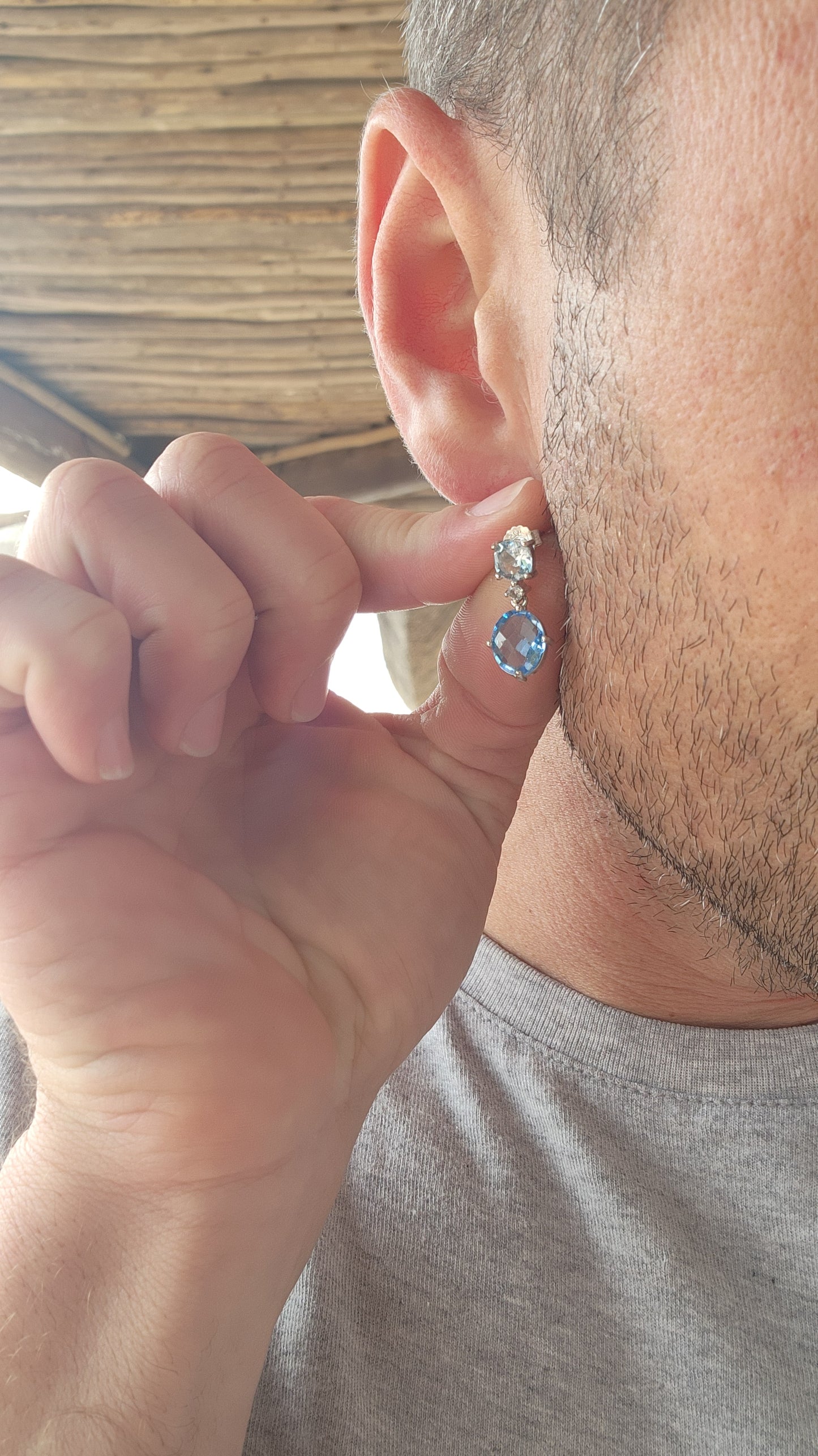 These sterling silver drop earrings are a masterful composition of elegance and radiance, showcasing the breathtaking beauty of blue topaz gemstones.