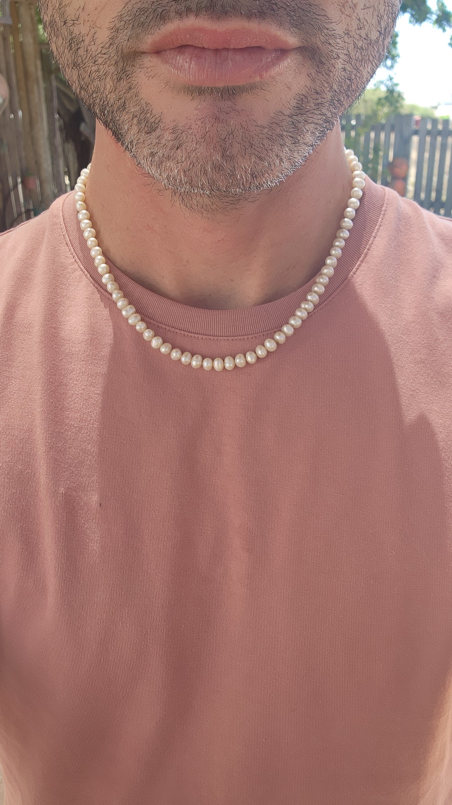 This vintage necklace epitomizes timeless elegance with its single strand of semi-round freshwater pearls.