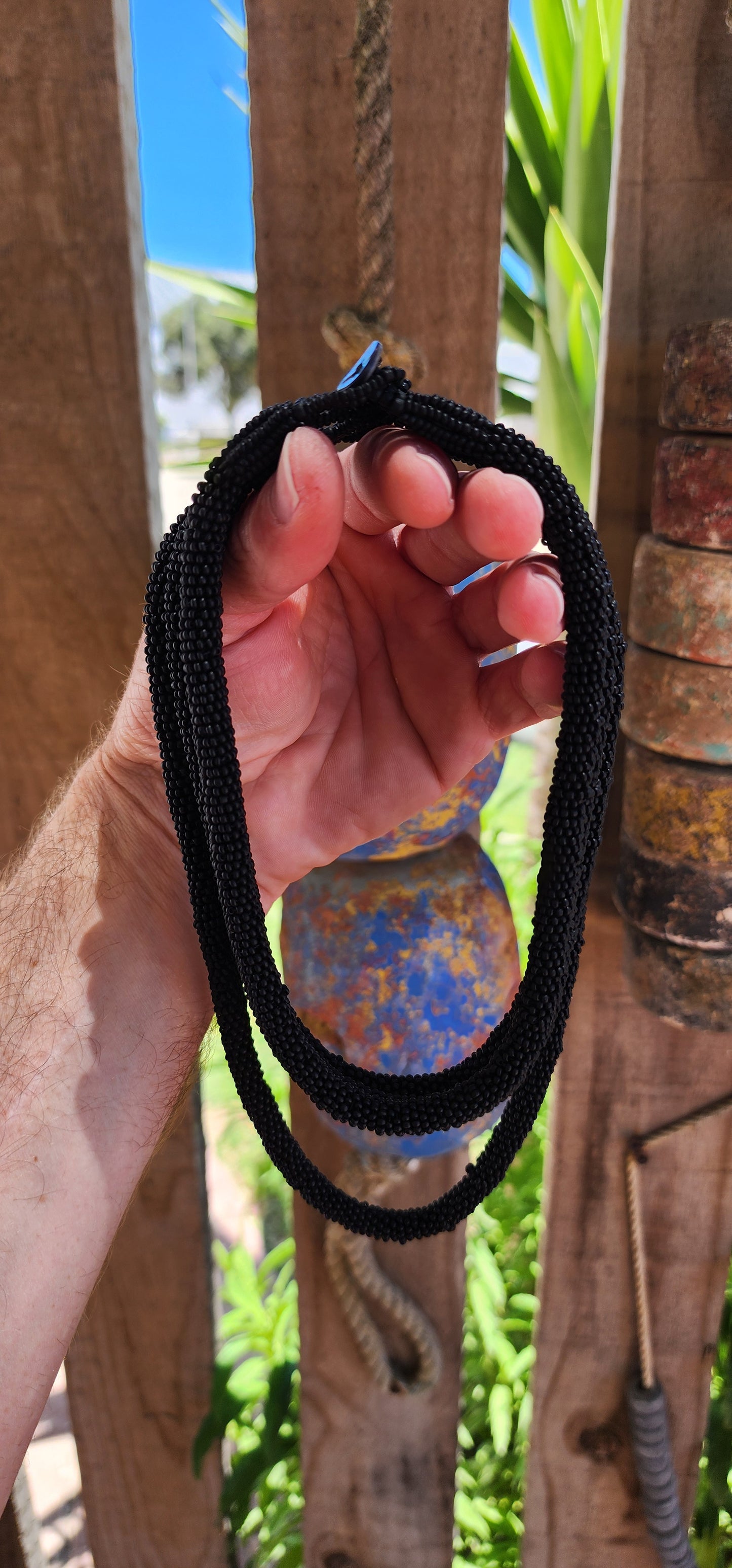 This exquisite handcrafted choker necklace is a true testament to skilled artistry and precision. Featuring four strands of finely detailed tubular crochet beadwork.