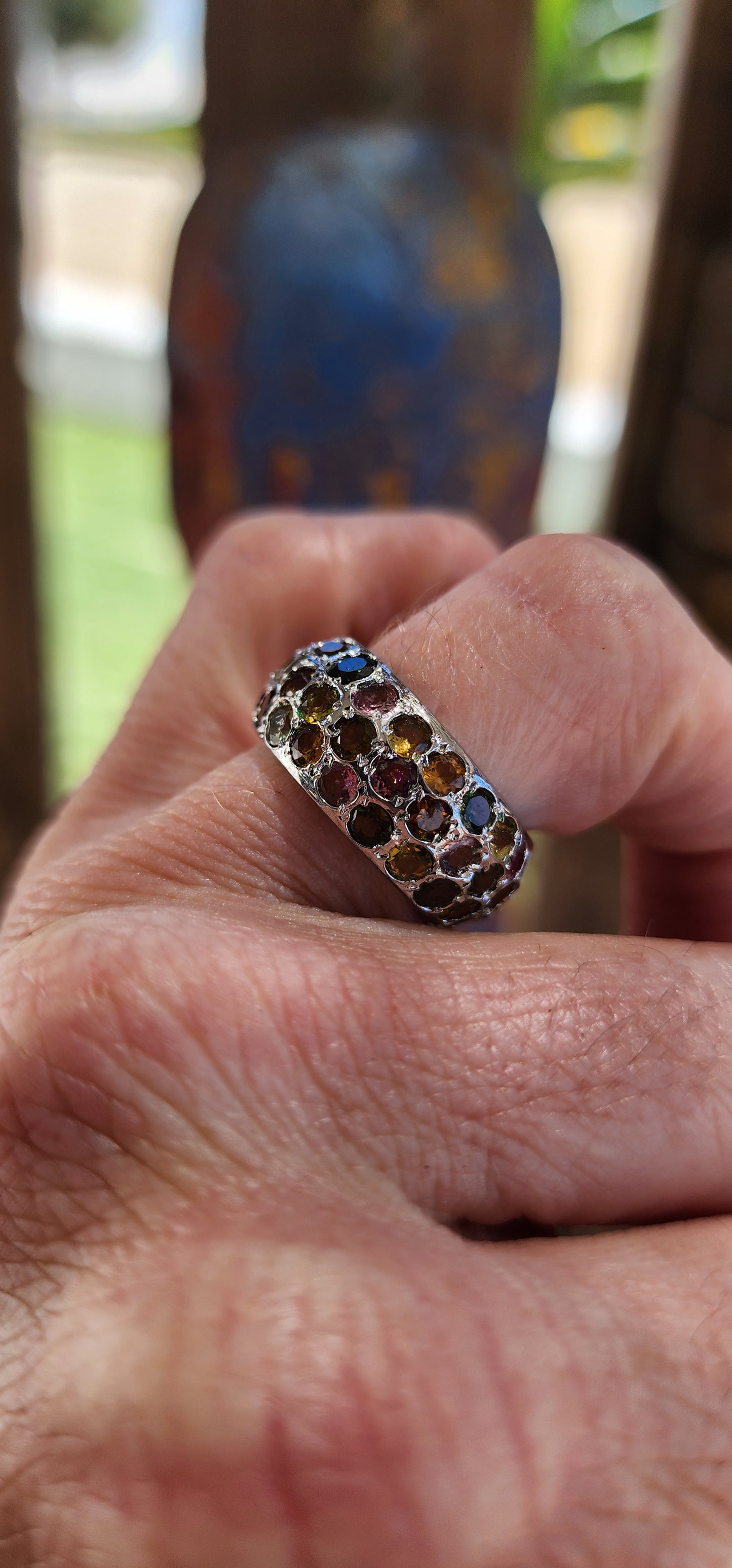 This full eternity ring is like a miniature carnival for your hand—a vibrant, joyful spectacle that refuses to be ignored! Its chunky domed design makes it a bold centerpiece, while the multicolored tourmalines are the stars of the show.