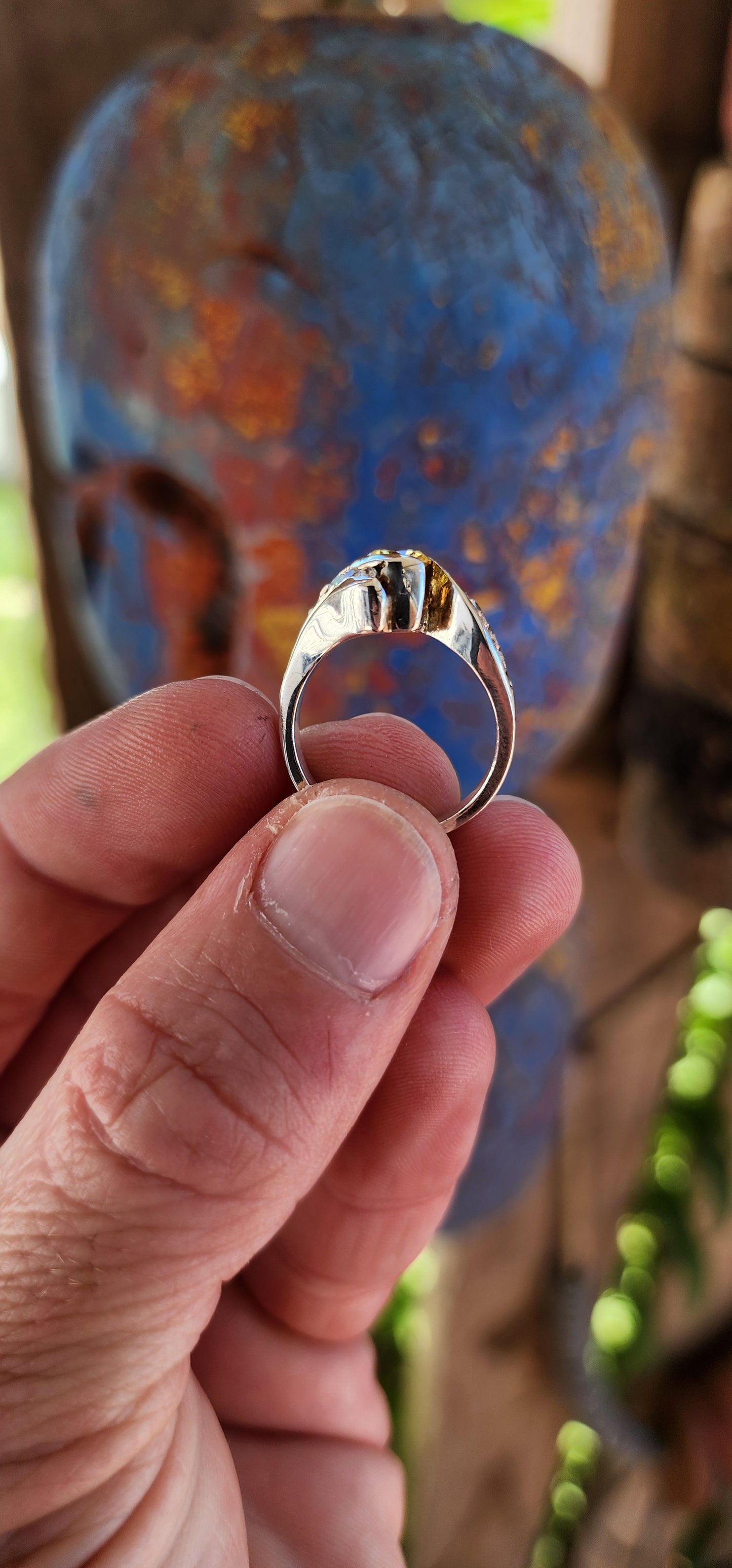 This breathtaking handmade sterling silver ring is a true work of art, seamlessly blending contemporary elegance with timeless beauty. The fluid, sculptural crossover design of the band exudes modernity while maintaining an air of classic refinement.